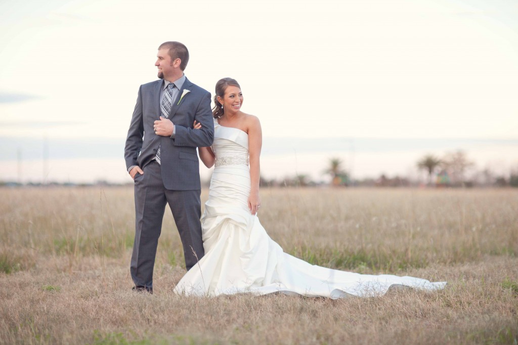 bride and groom in field