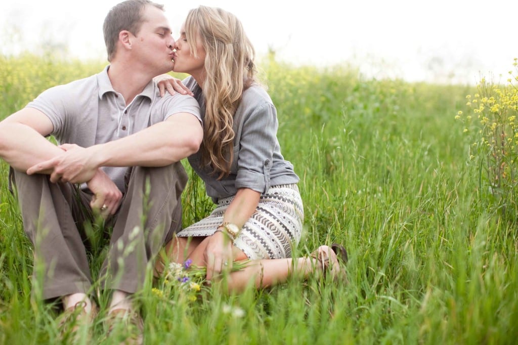 kissing in a field