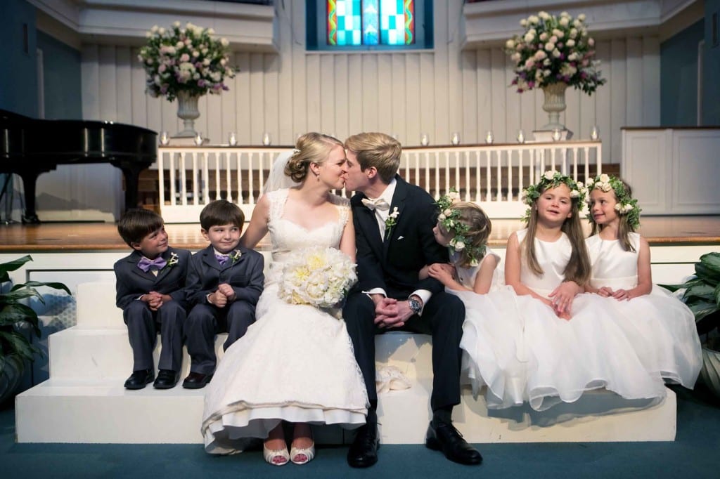 bride and groom with flowergirls