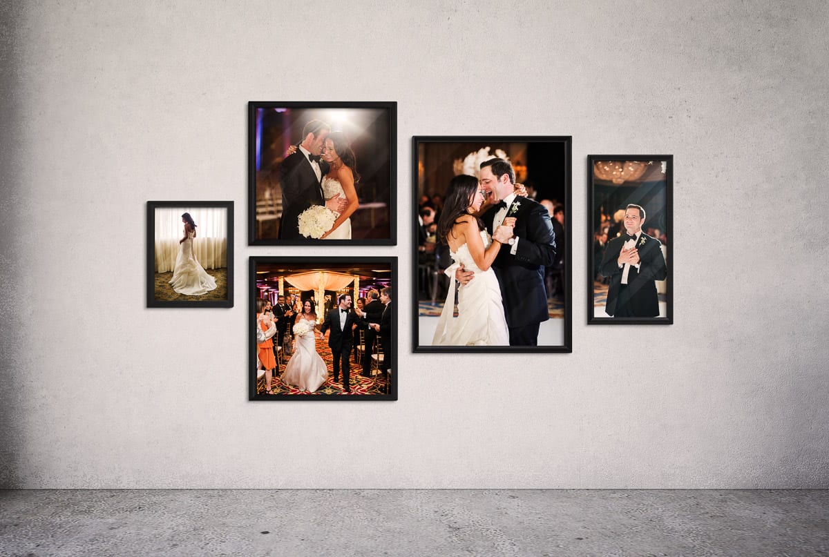 A wall of framed portraits of a bride and groom at their wedding reception, showing how easy it is to display your photos