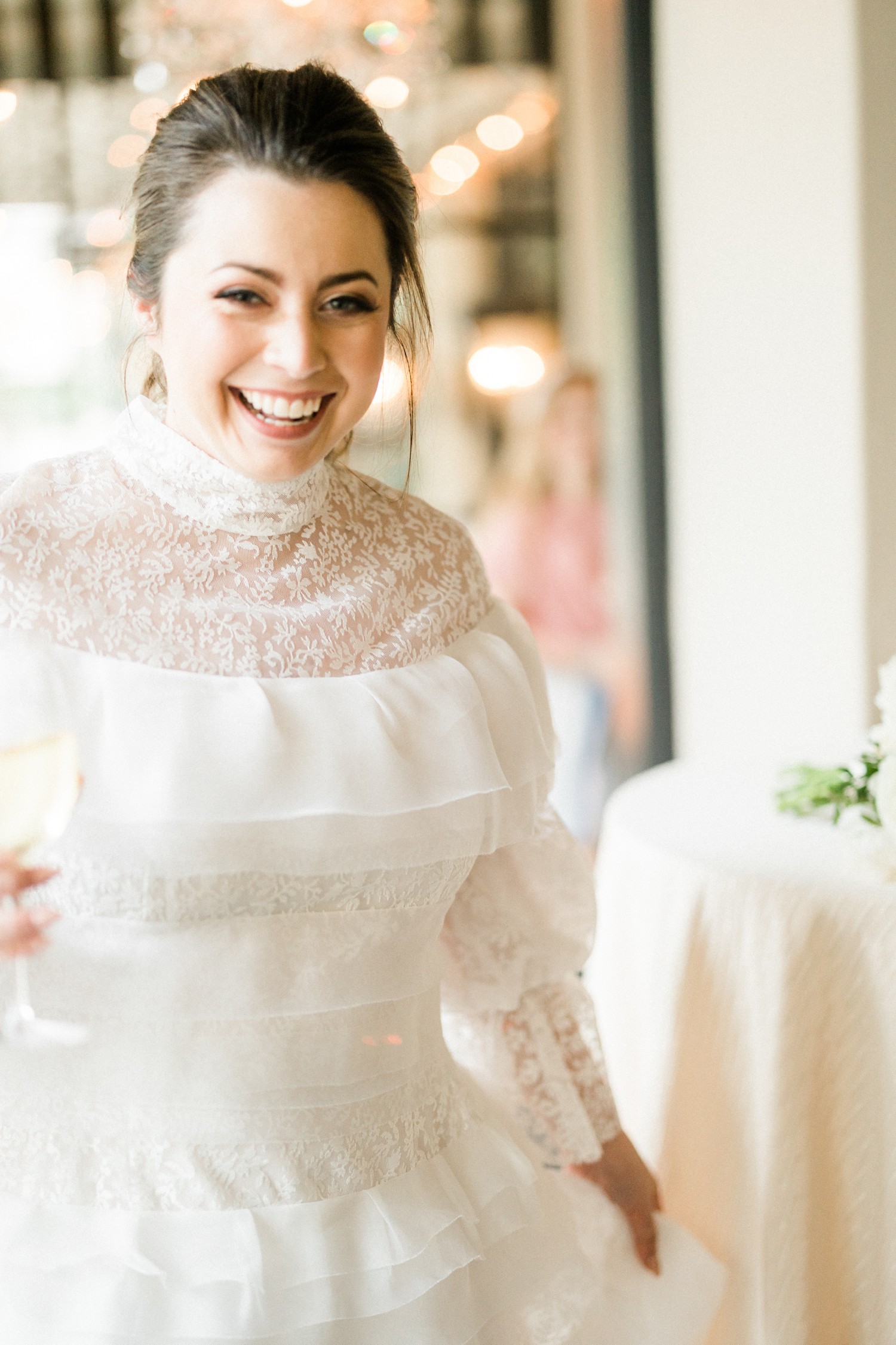 Bride smiling at wedding rehearsal dinner