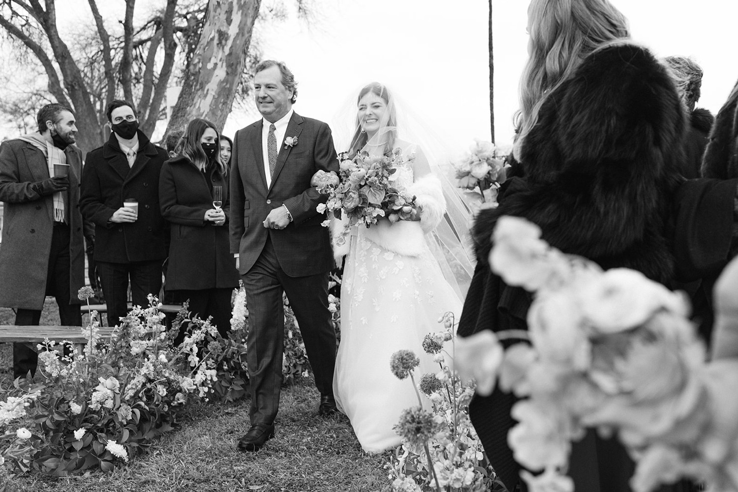 Bride walking down aisle with father