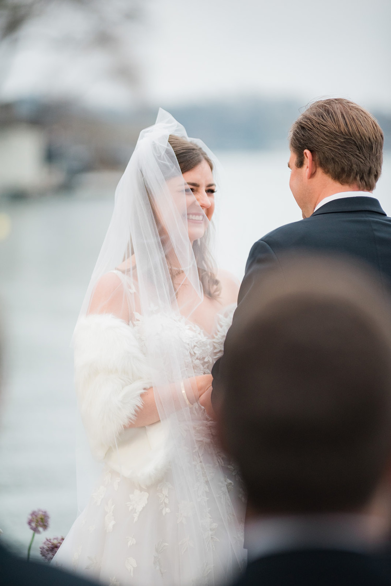 Bride smiling at groom during vows