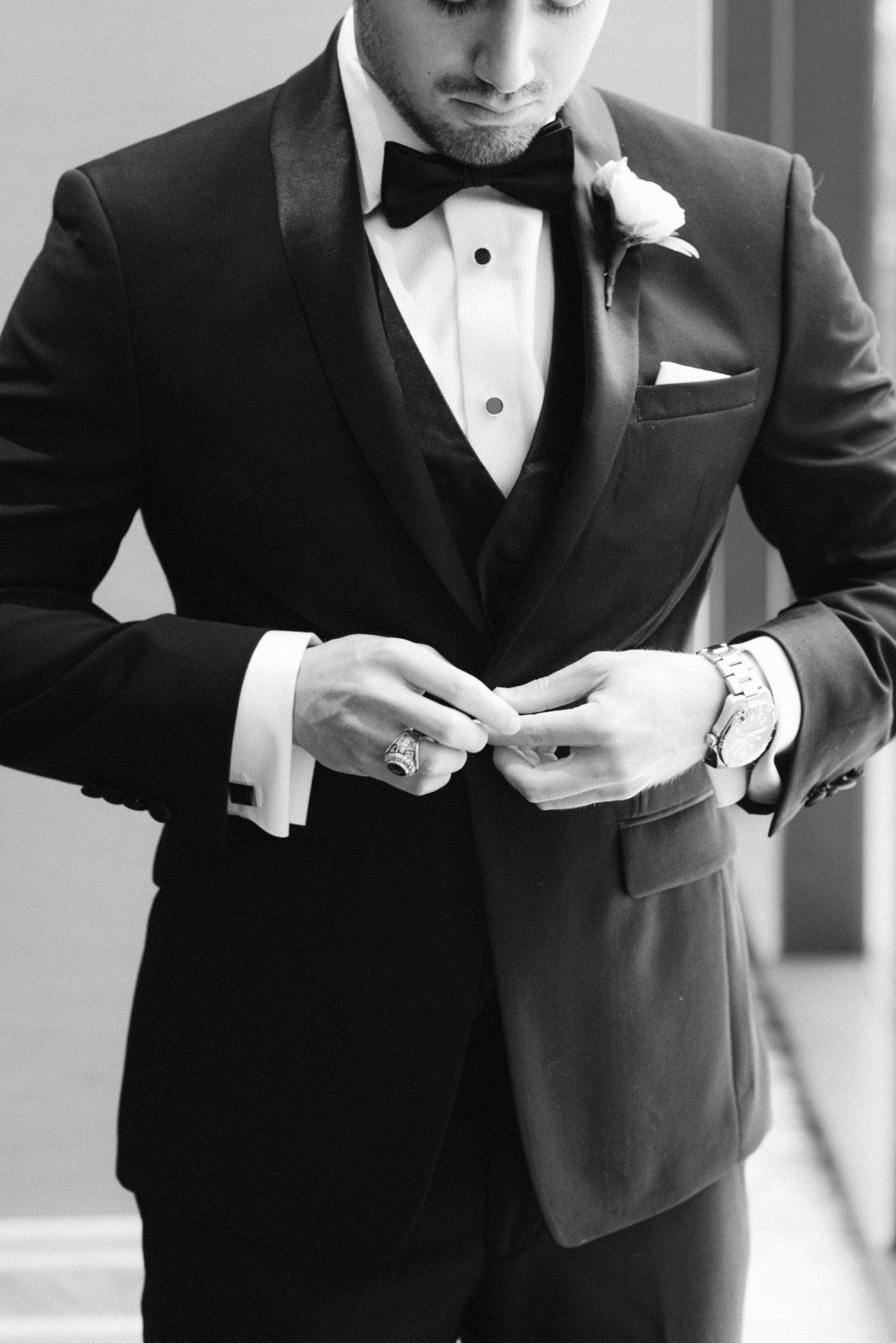 Groom Buttoning Suit