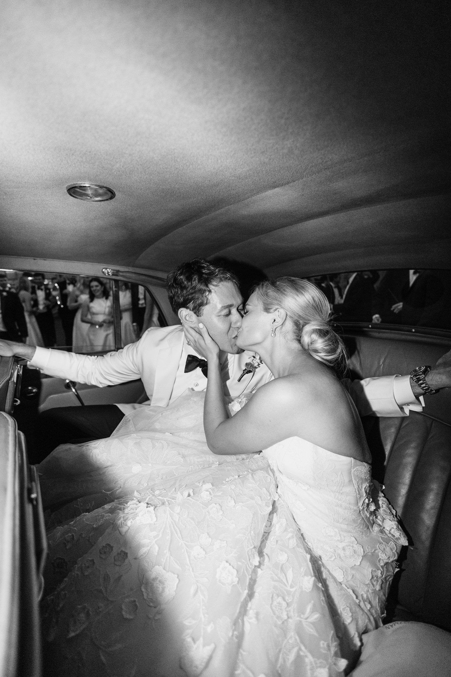 bride and groom wedding getaway car kiss