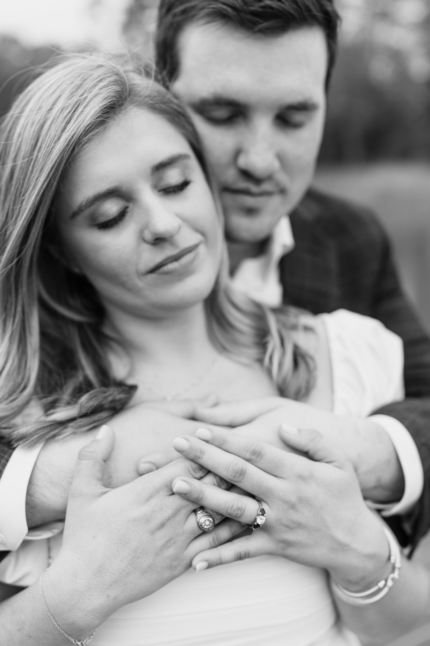 Engagement Photos with couple hugging from behind. 