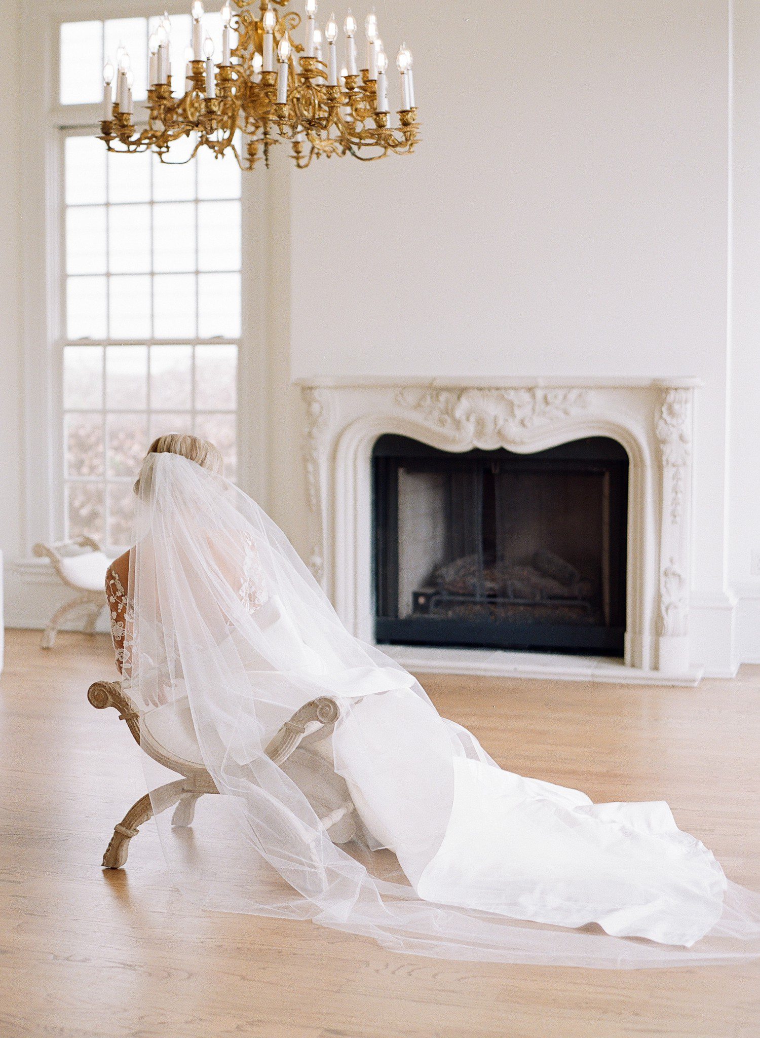 Seated bridal portraits with back of bride.