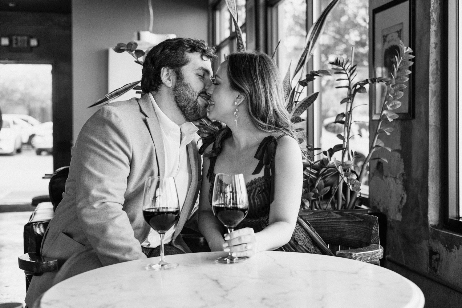 Engagement Photos in Houston Heights with wine glasses