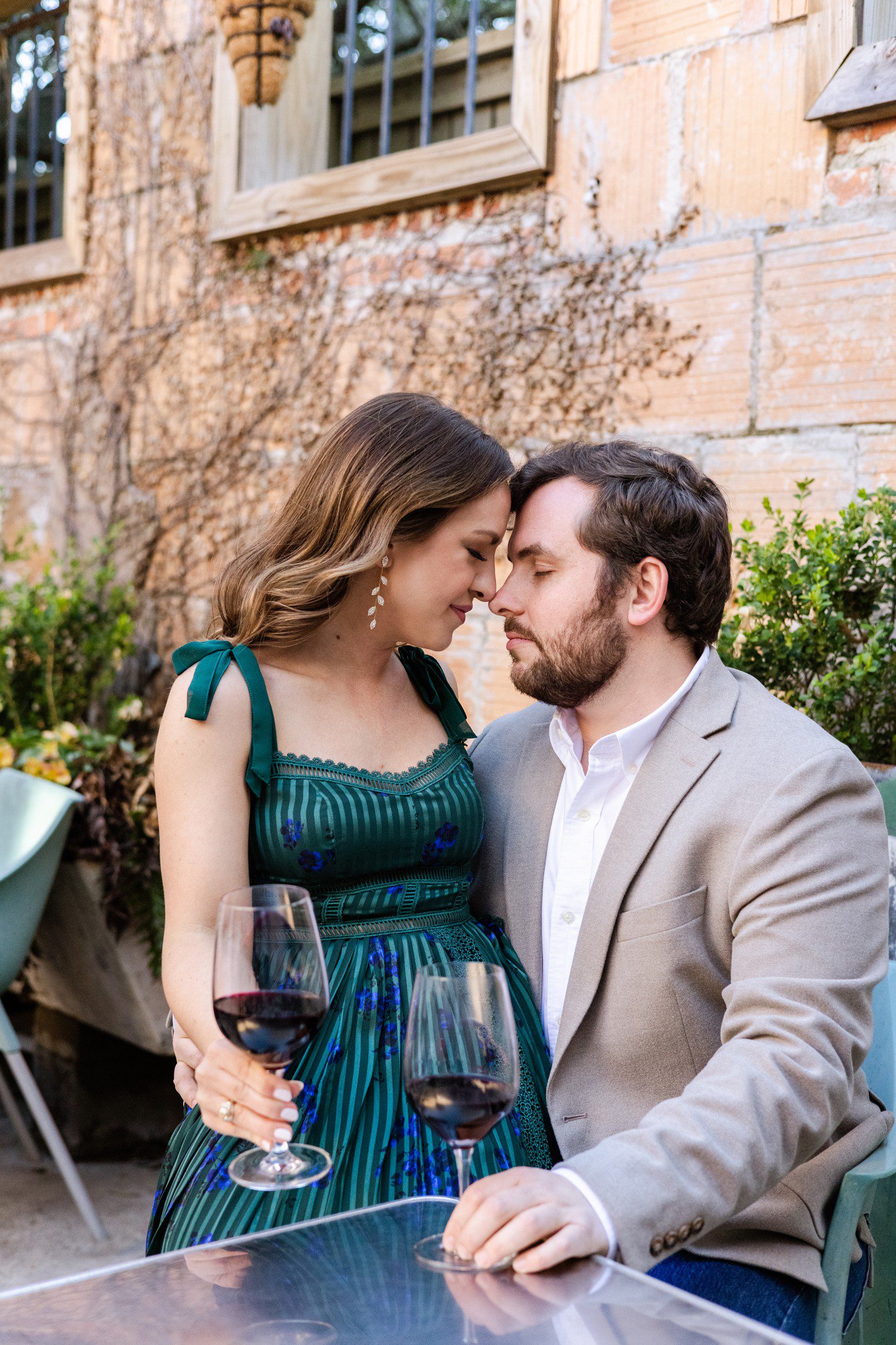 Houston Engagement Photos with glasses of wine 
