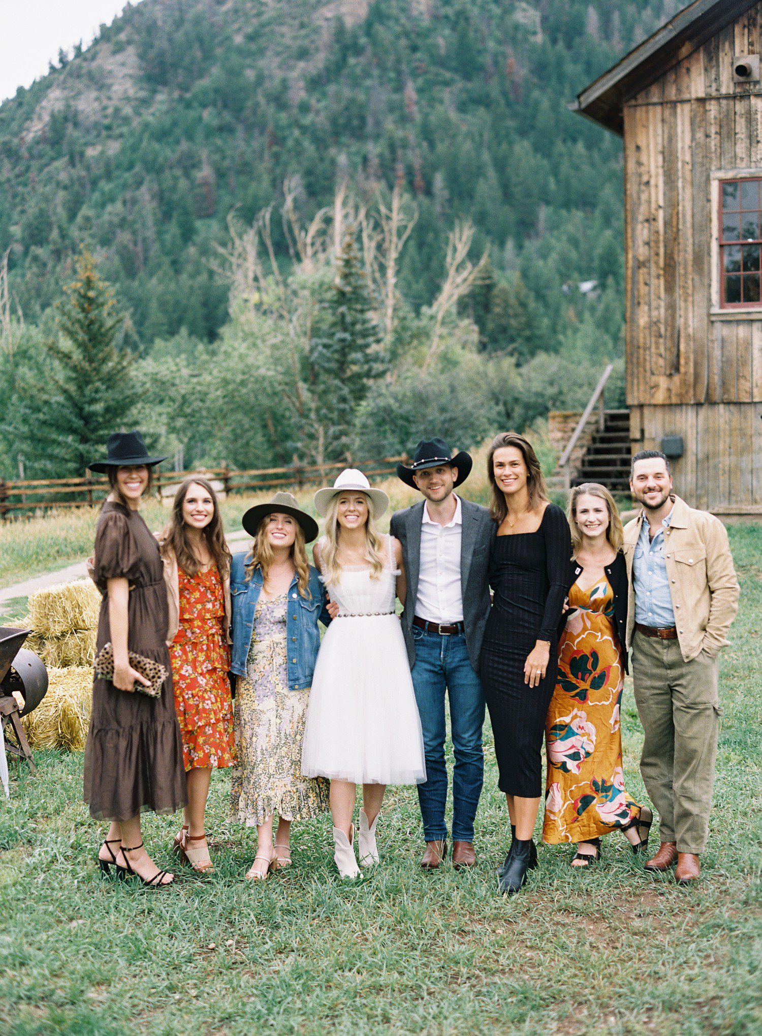 Bride and groom with friends at wedding rehearsal in Aspen. 