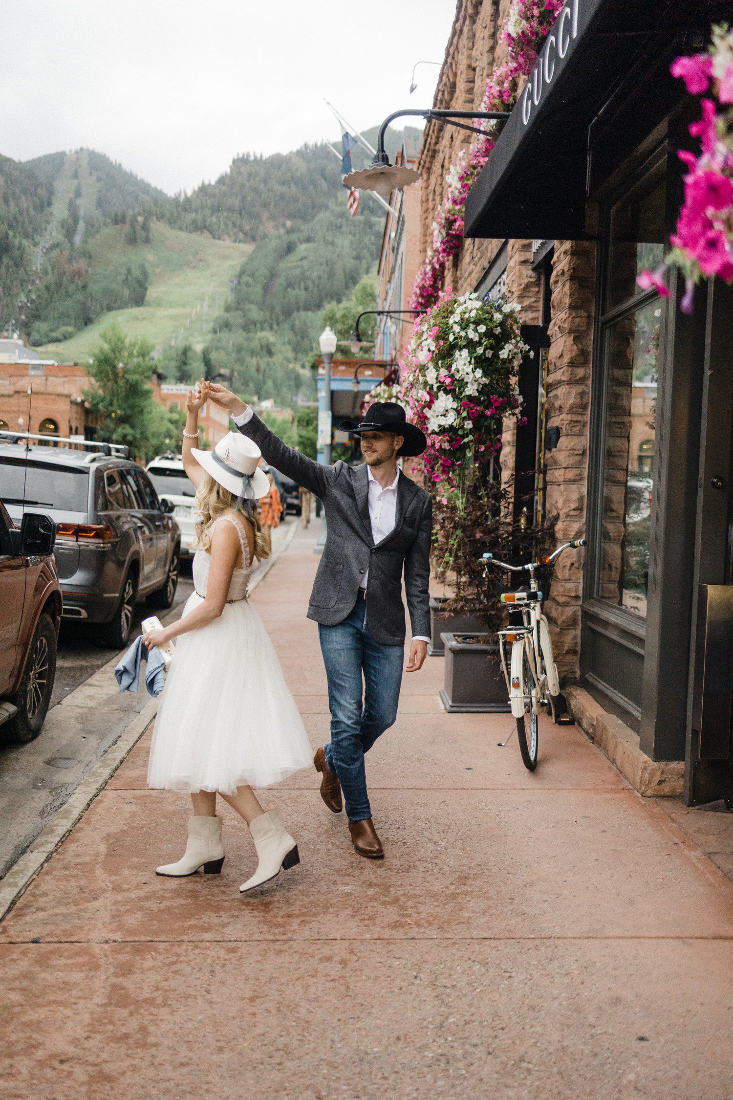 Couple walking in downtown Aspen together. 