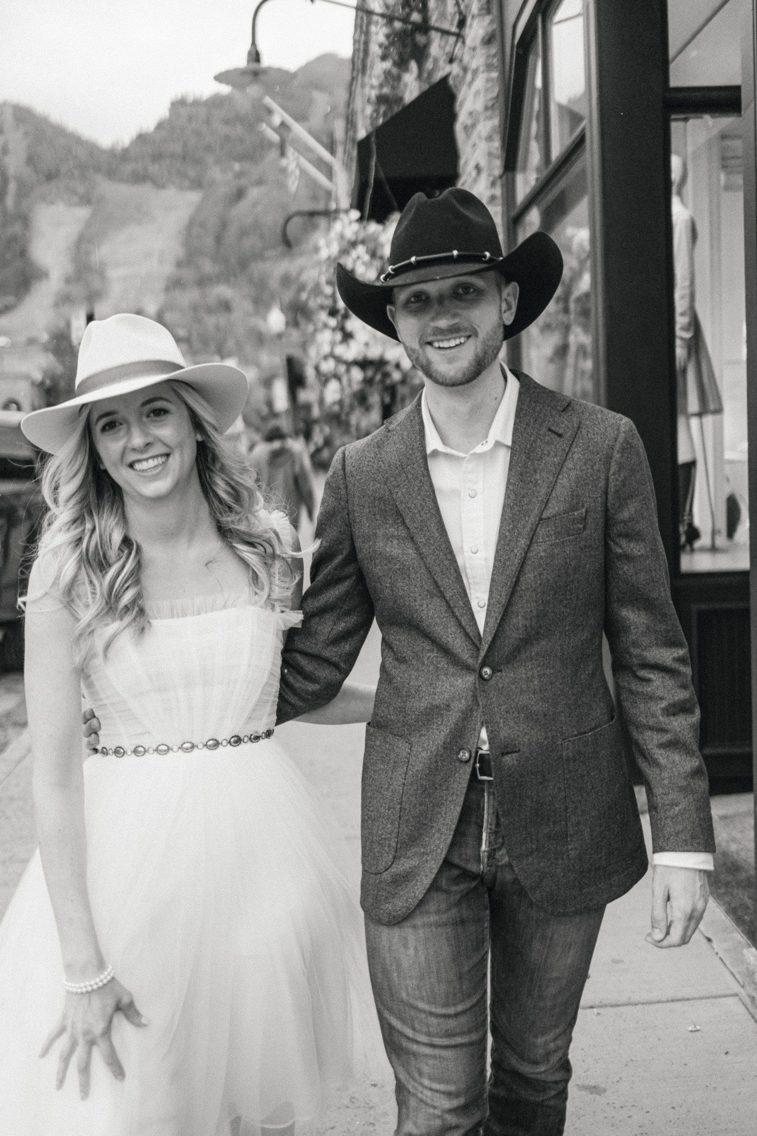 Bride and groom wearing custom Kemo Sabe cowboy hats. 