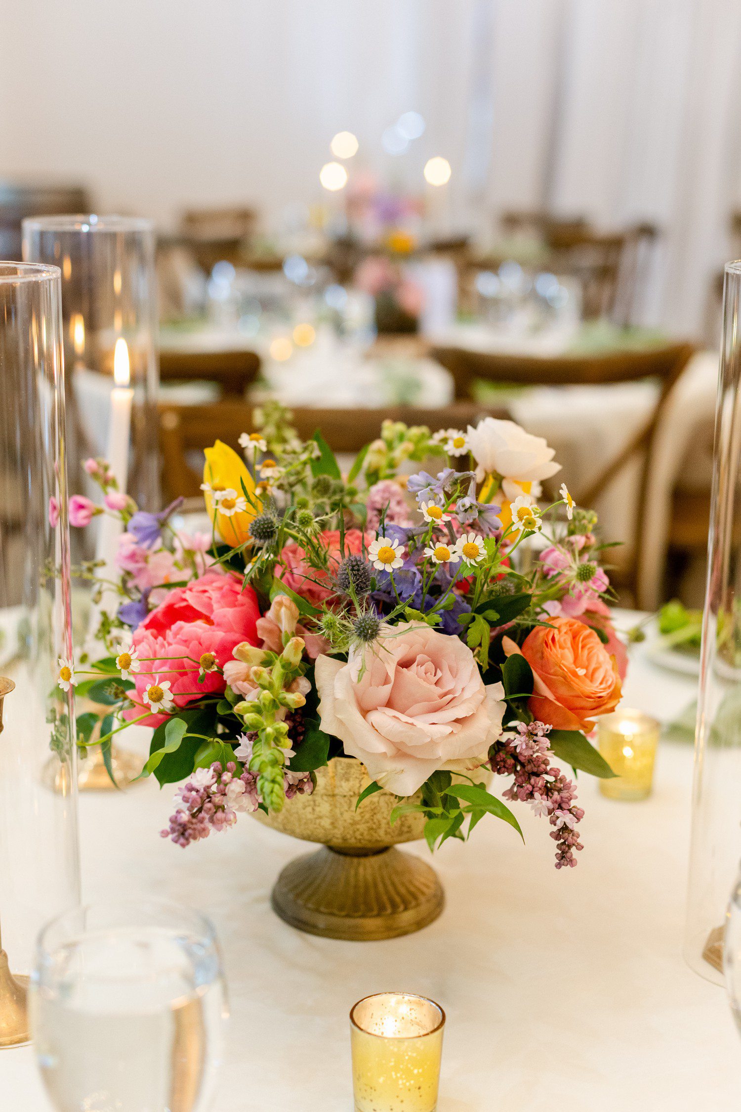 Colorful wedding table bouquets at Sendera Springs.