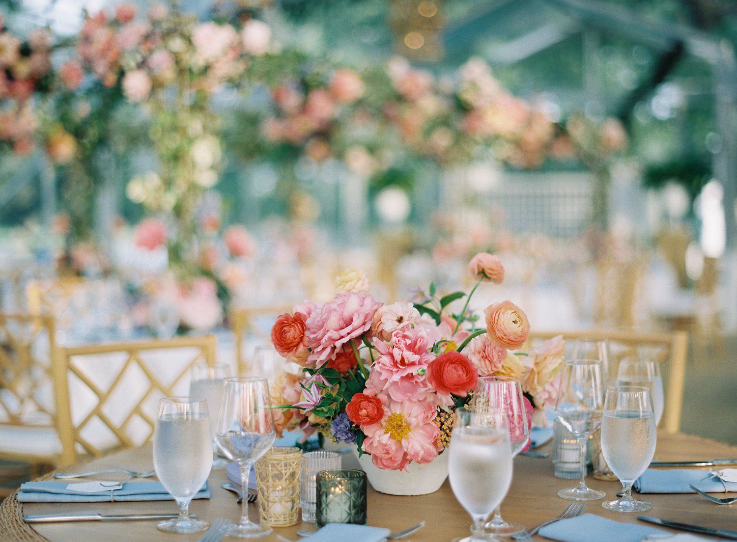 Colorful wedding reception table flowers. 
