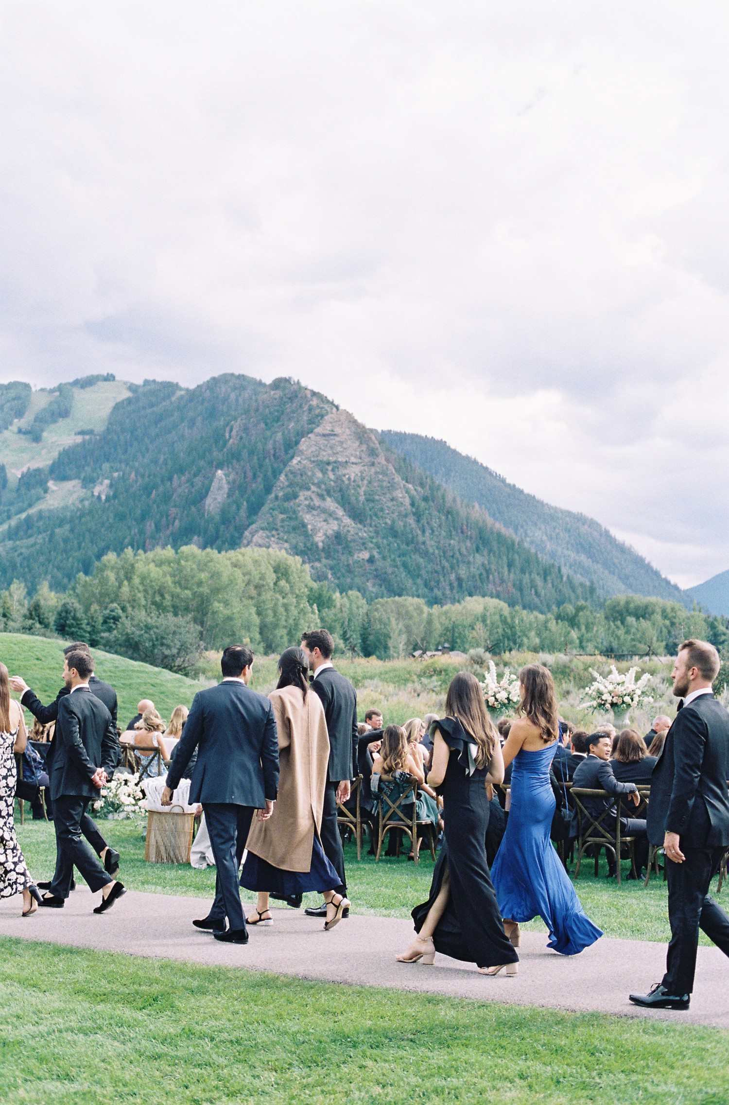 Guests arriving to wedding ceremony at Aspen Meadows Resort. 