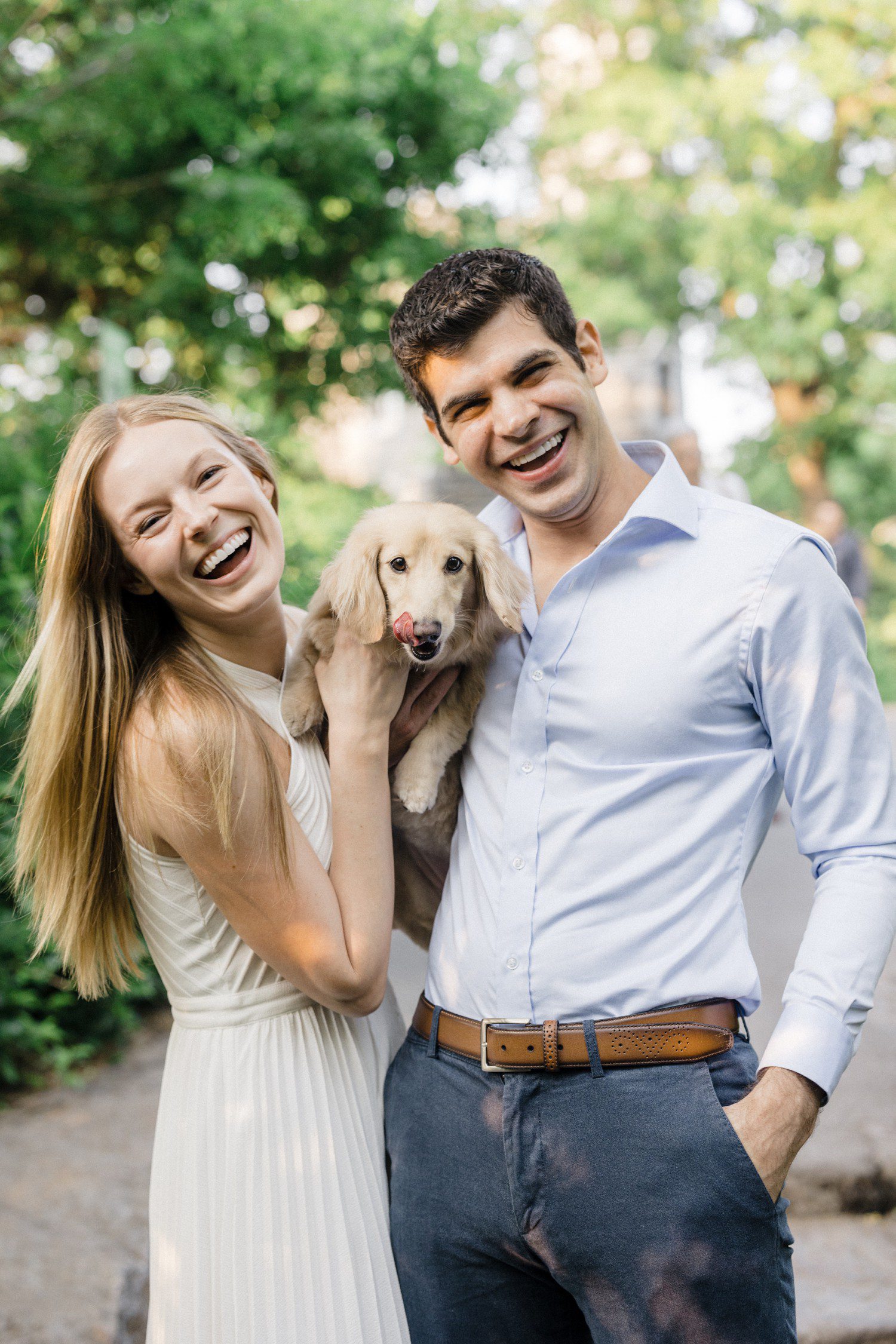 Central Park Engagement photos of couple with dog. 