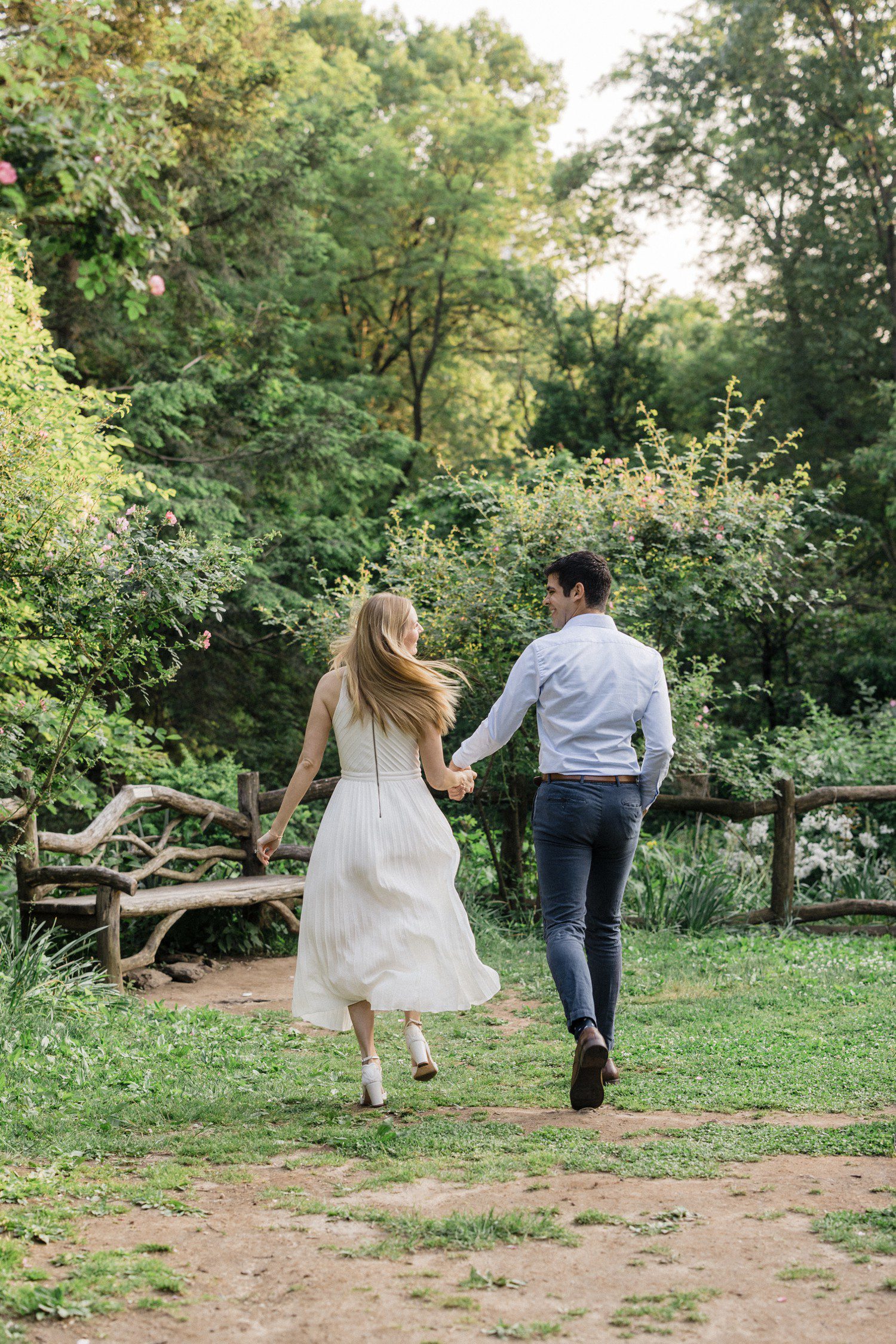 Couple walking in NYC in Central Park for engagement photos. 