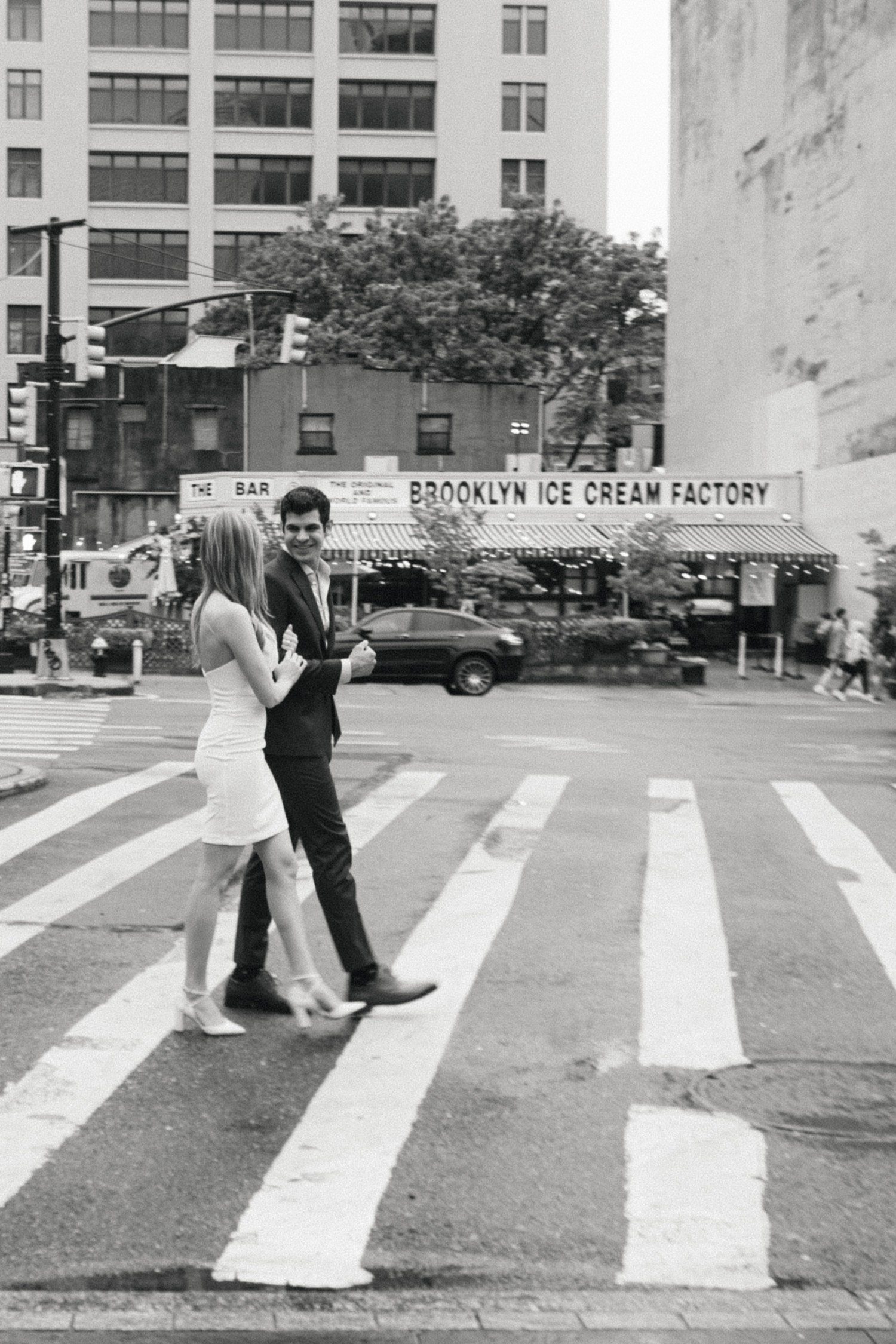 Couple walking for engagement photos in Brooklyn. 