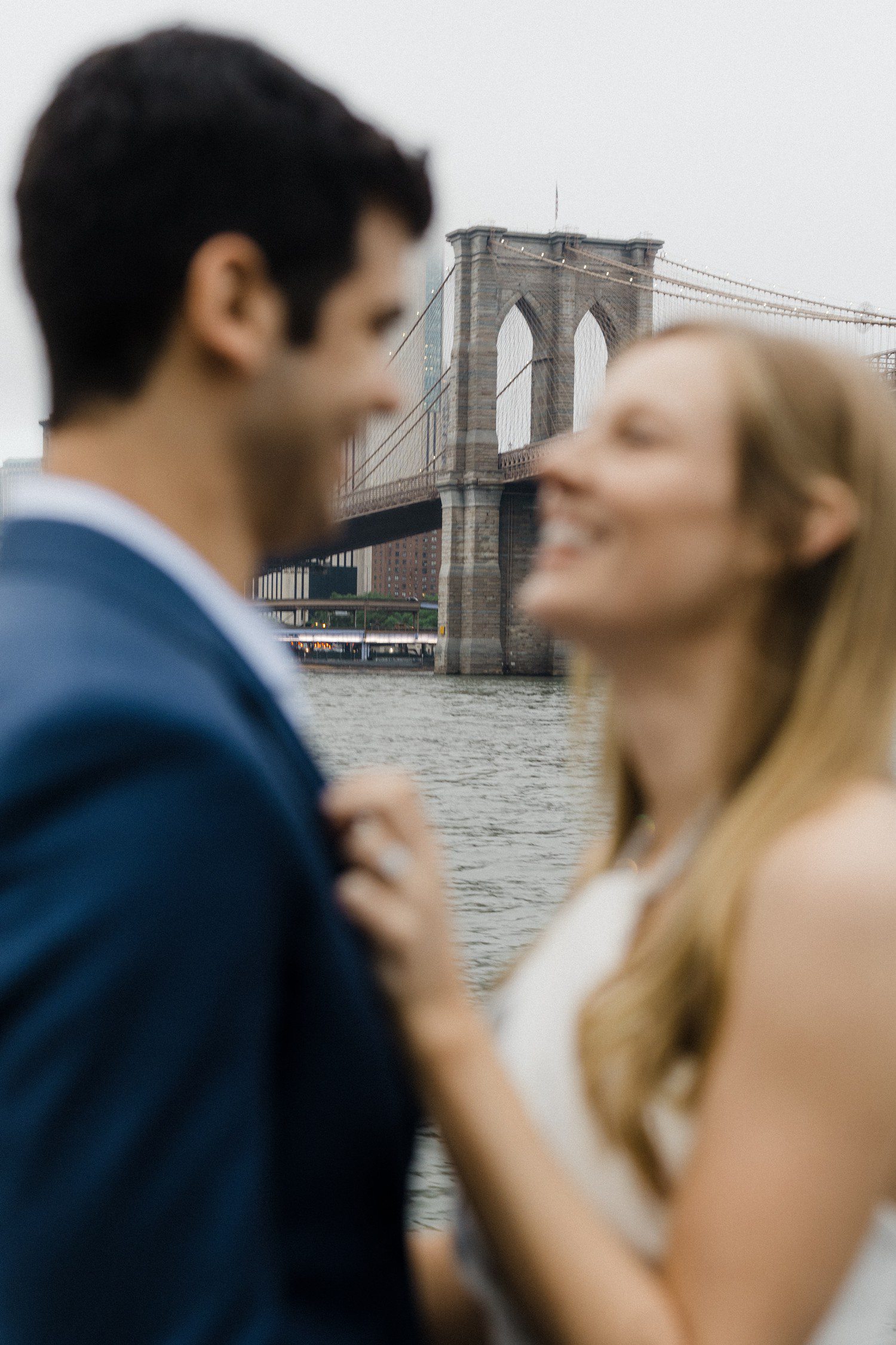 Couple engagement photos at Brooklyn Bridge. 
