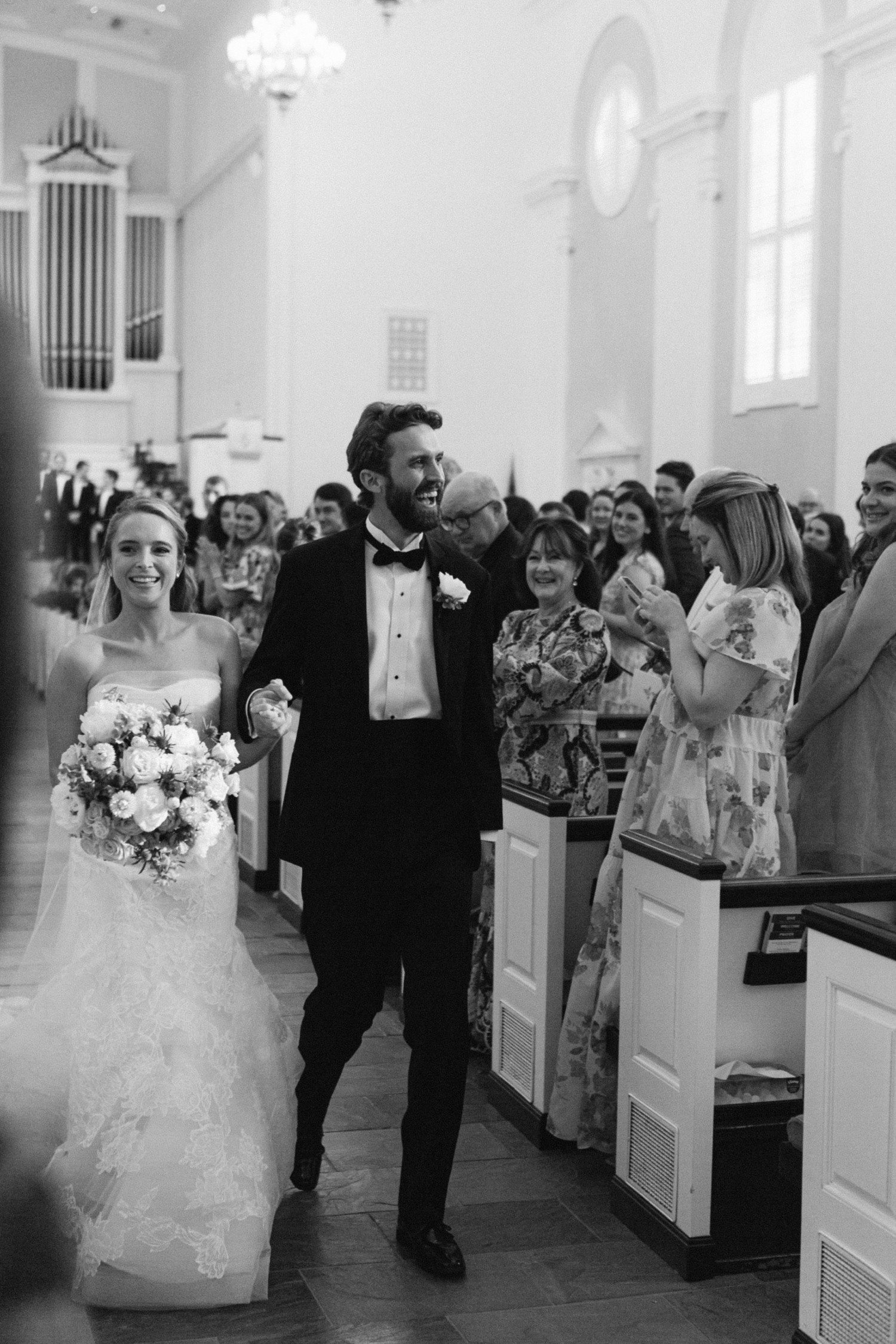 Bride and groom walking down aisle at St. Luke's United Methodist Church in Houston. 