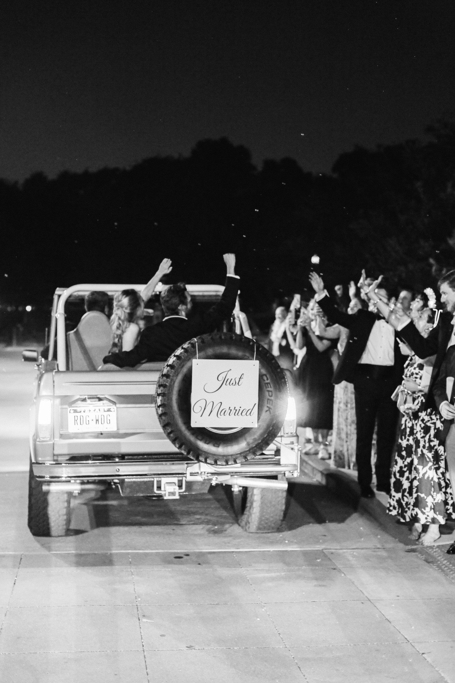 Ford Bronco wedding getaway car leaving reception. 