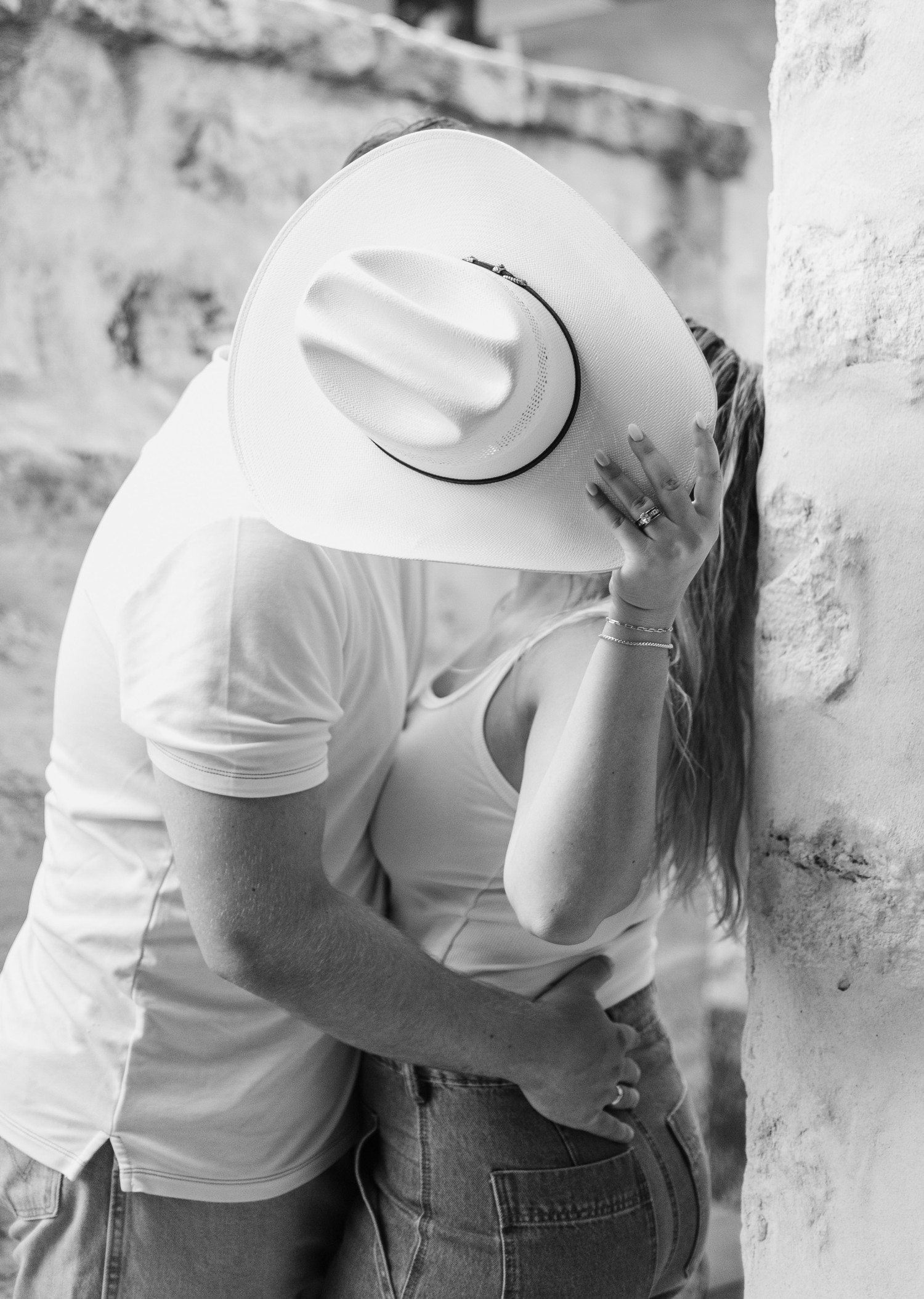 Engagement photos with cowboy hat. 