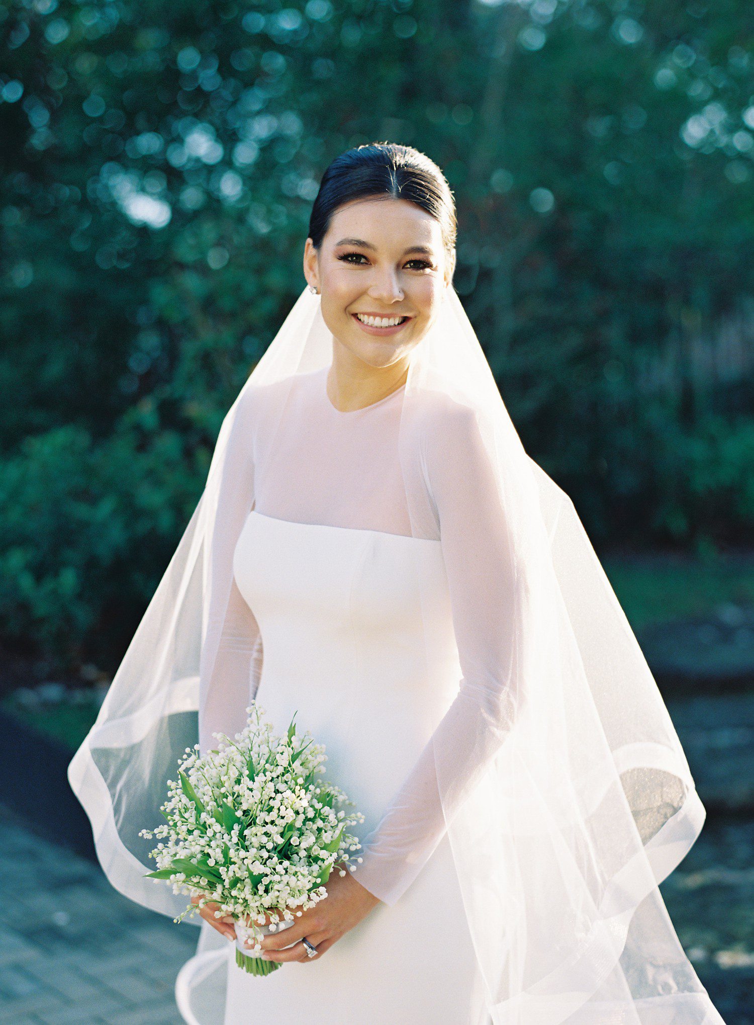 Bridal portraits in Houston with veil and bouquet of baby's breath.