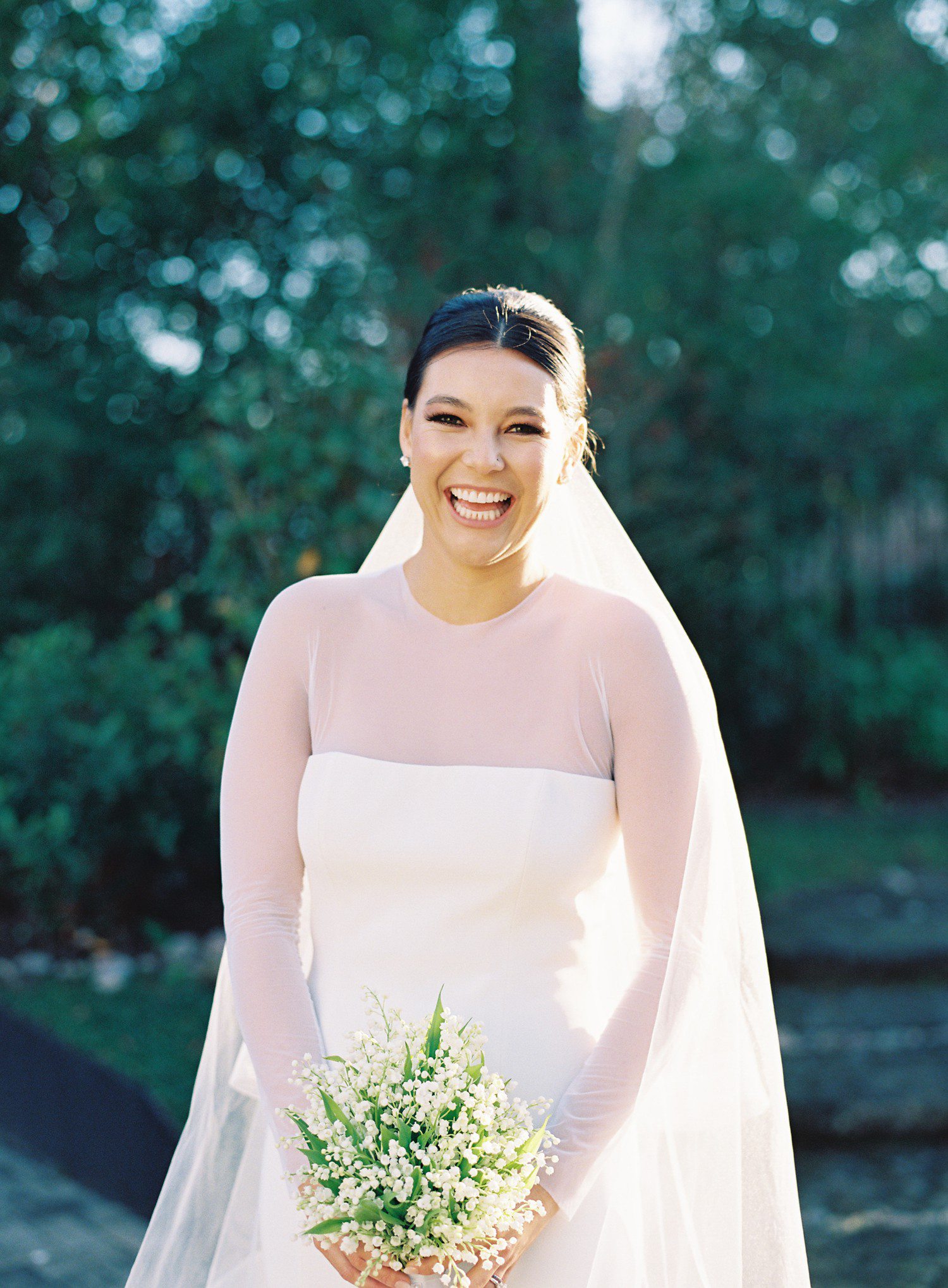 Bride laughing during bridal portraits in Houston. 