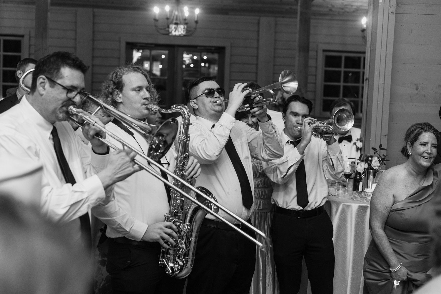 The Manhattan band playing horns at wedding reception. 
