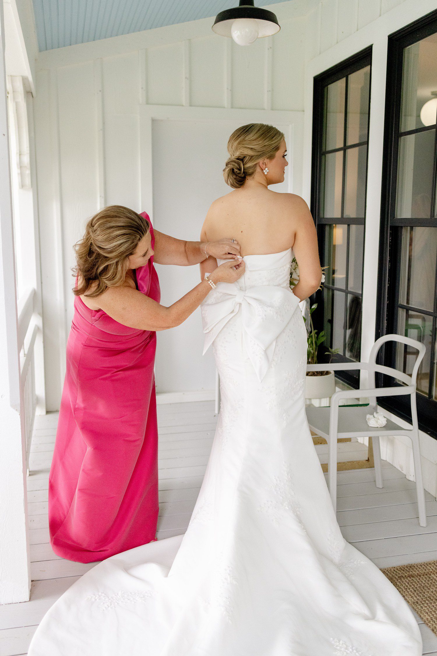 Mom helping bride get ready at The Frenchie. 