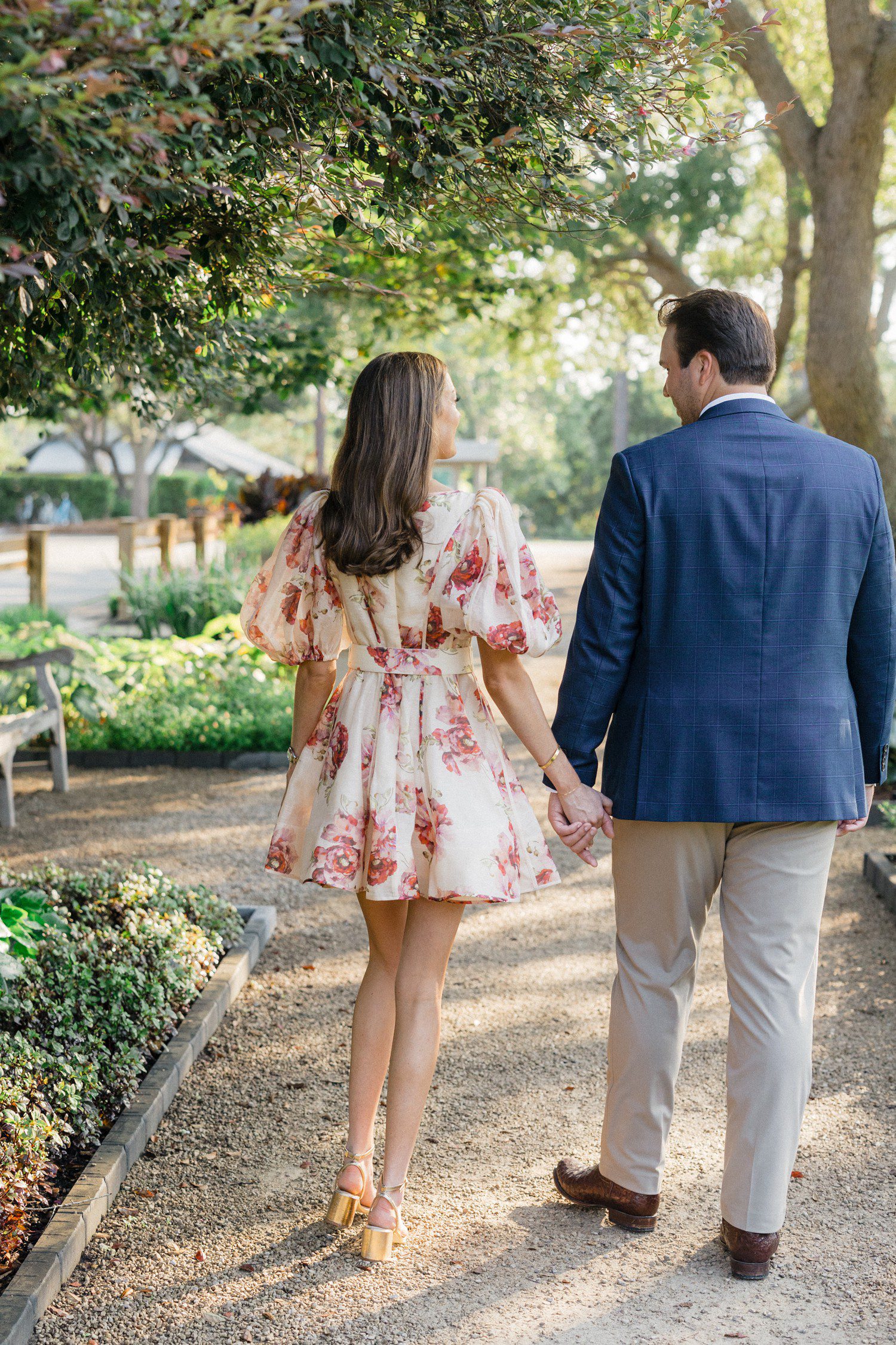 Couple walking in park in Watercolor Florida for engagement photos. 