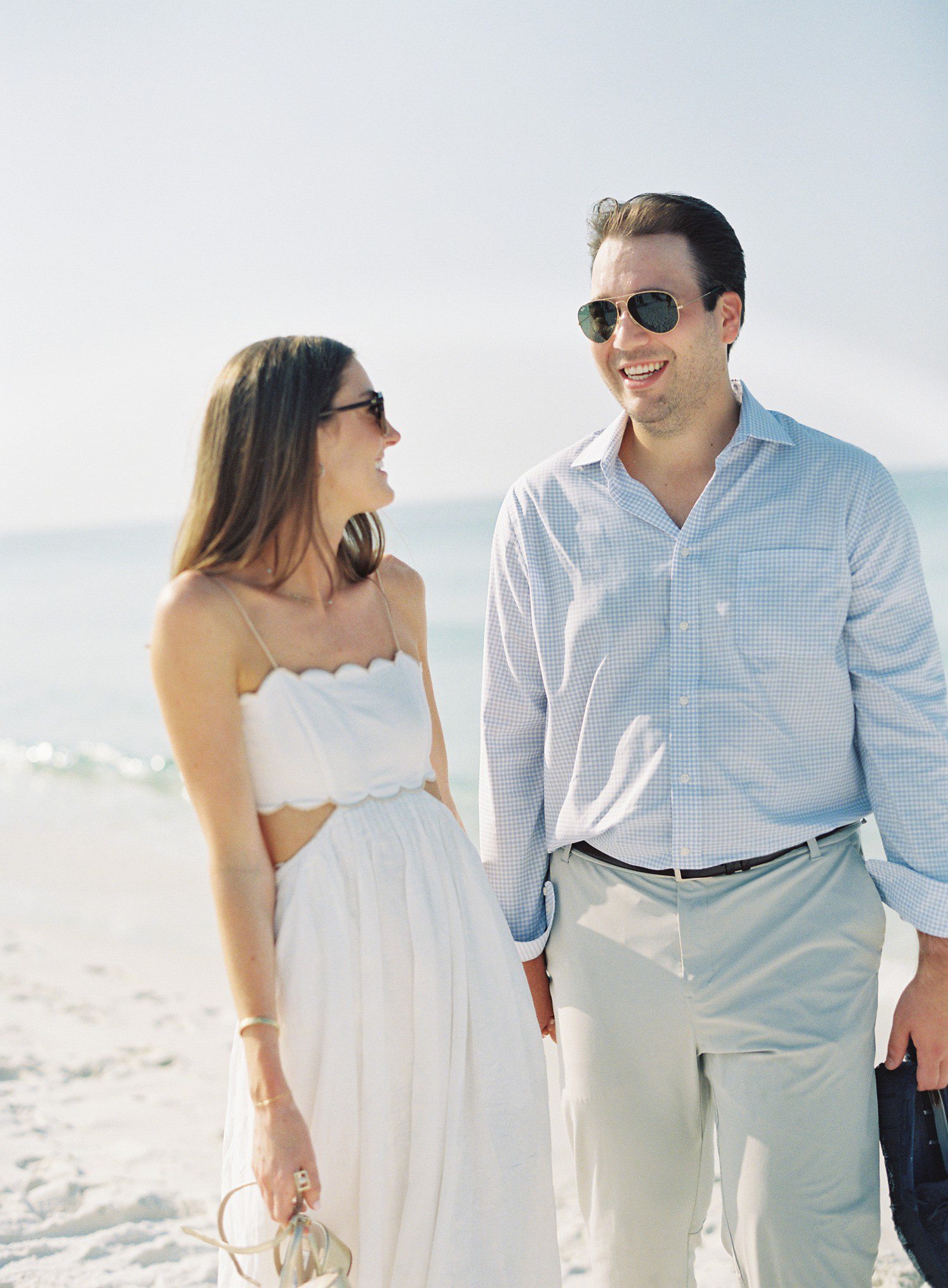 Couple walking for engagement session in Watercolor, Florida. 