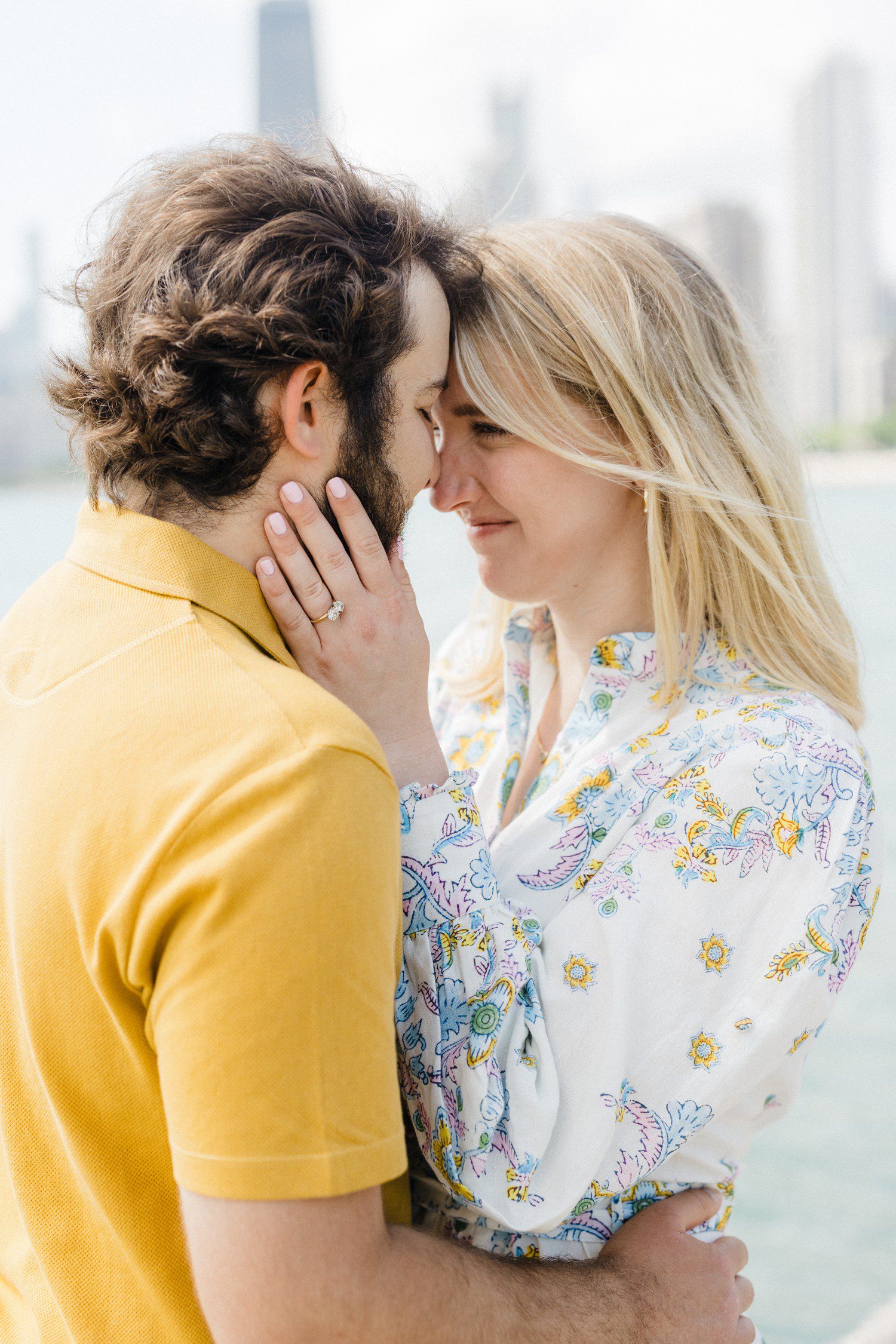 Couple forehead to forehead for engagement photos. 