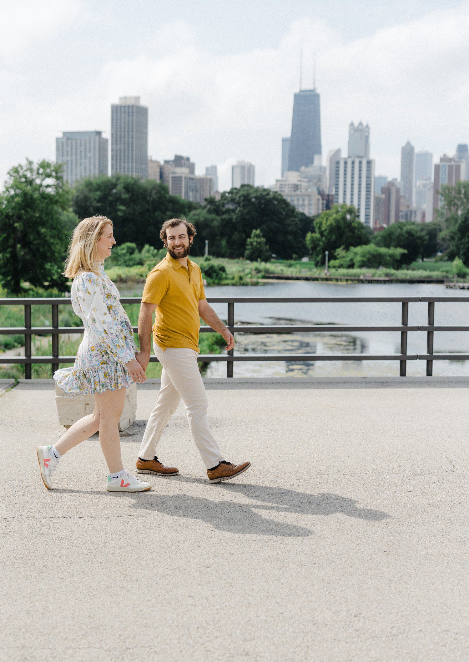 Couple walking in Lincoln Park in Chicago for engagement photos. 