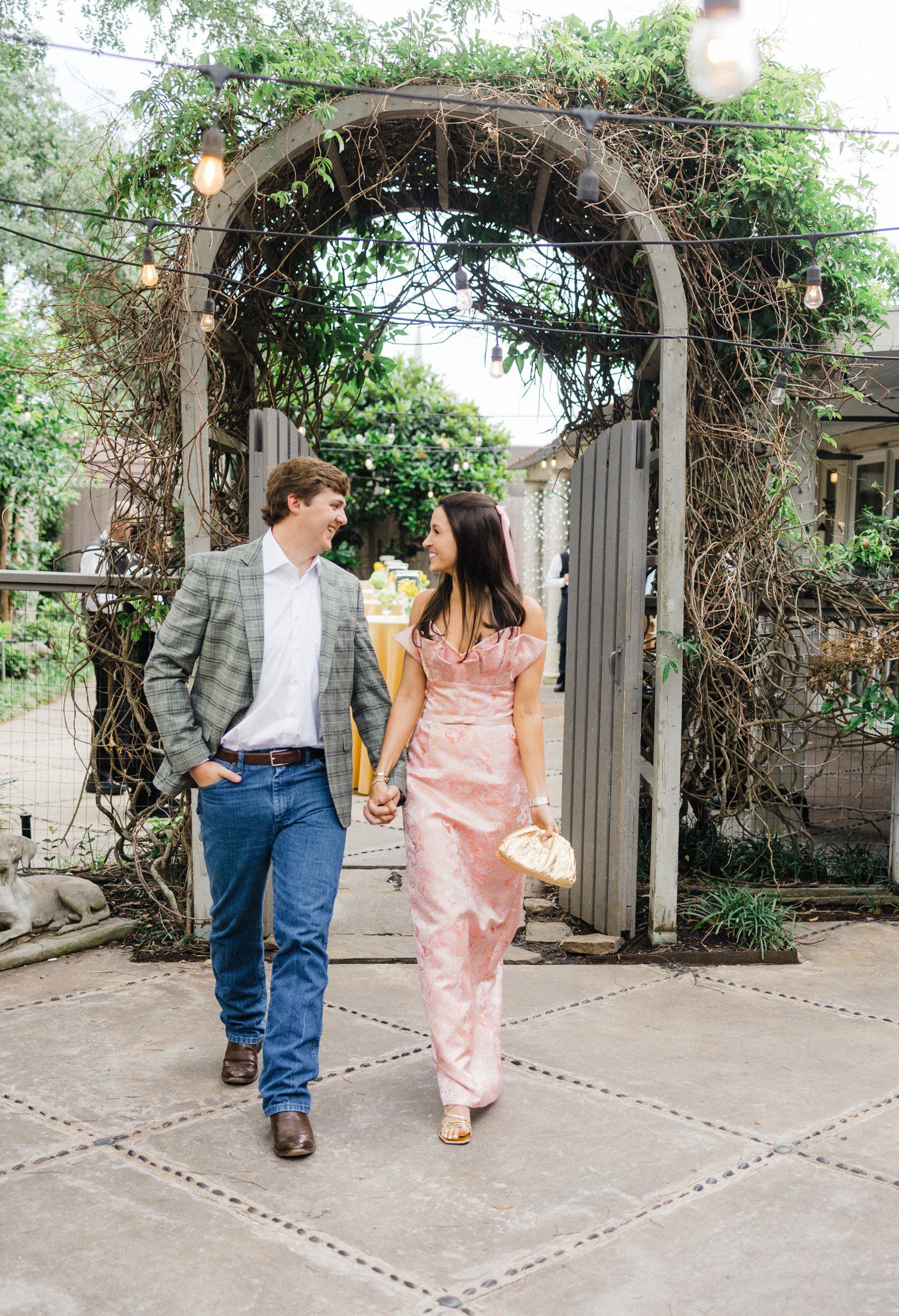 Couple walking together before rehearsal dinner in Houston.