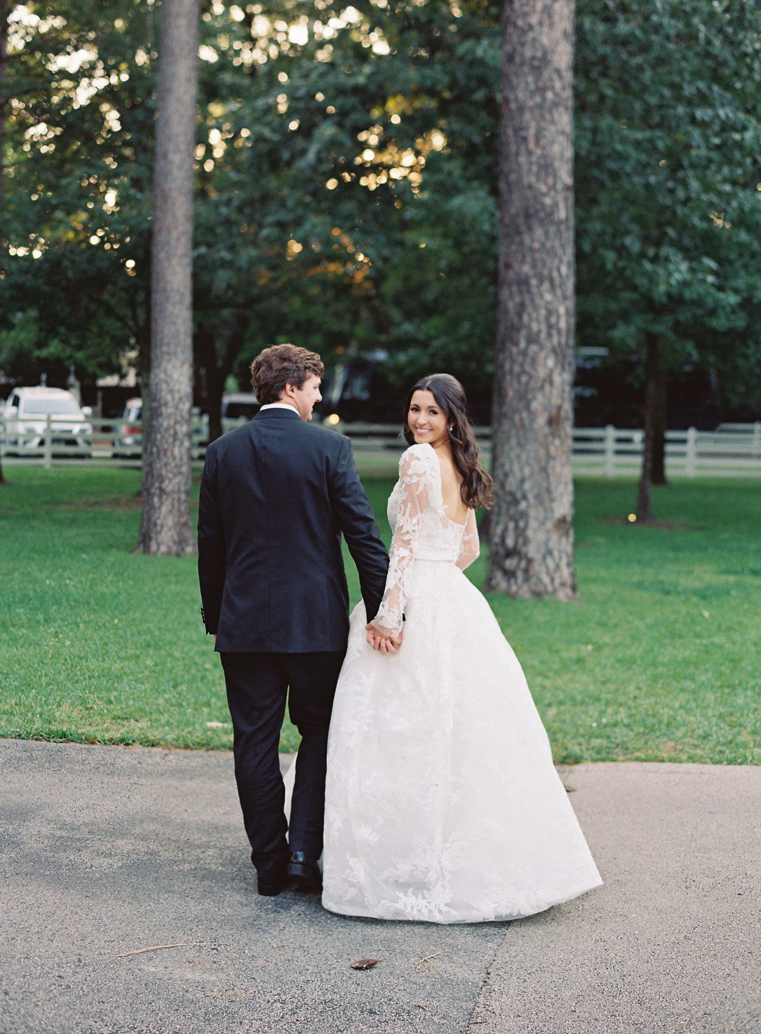 Bride and groom walking at The Forest Club in Houston.