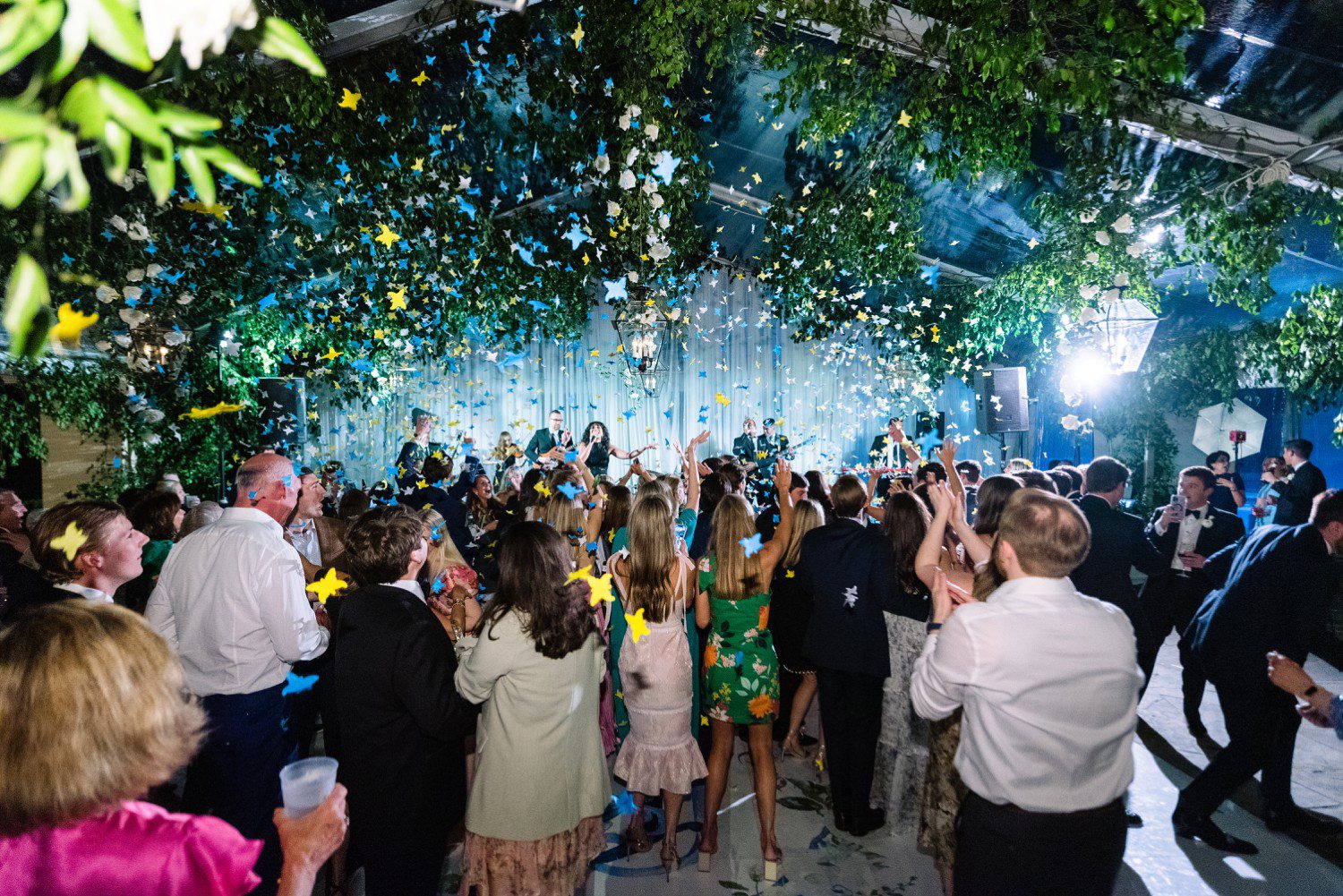 Wedding reception at The Forest Club in Houston with confetti on dance floor.