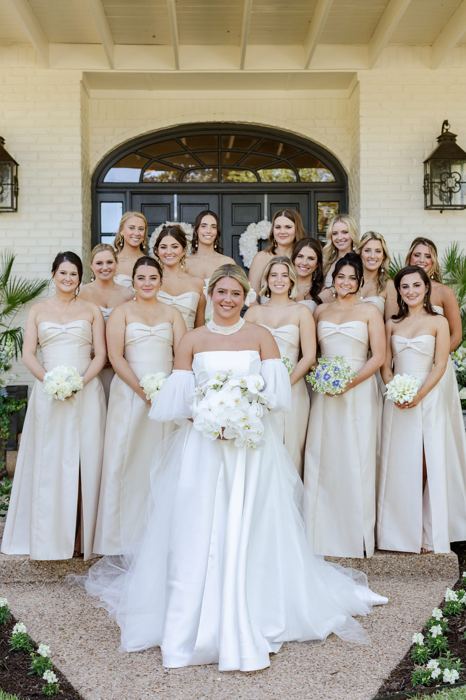 Bride and bridesmaids in champagne dresses.