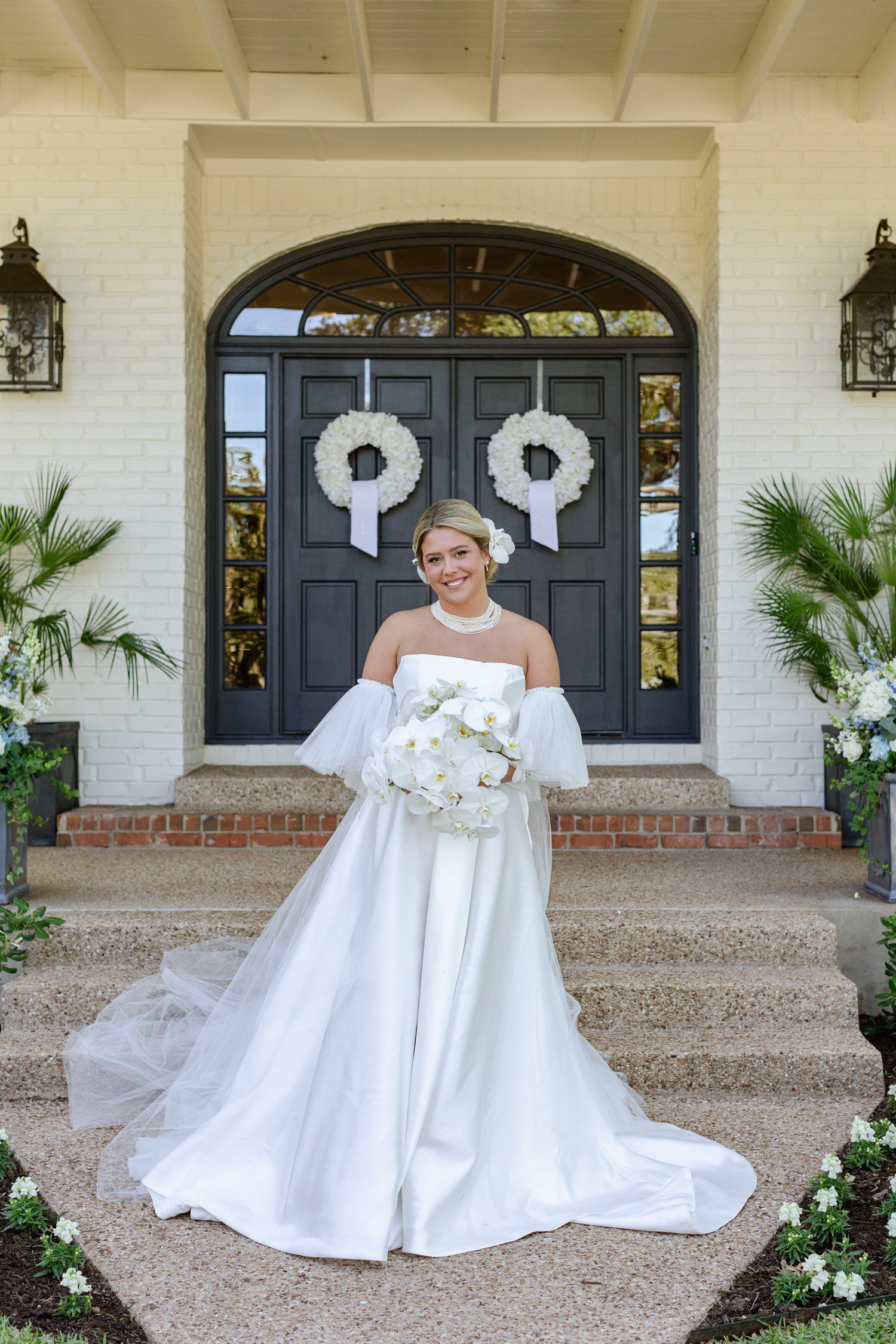 Bridal portraits with white orchid bouquet.