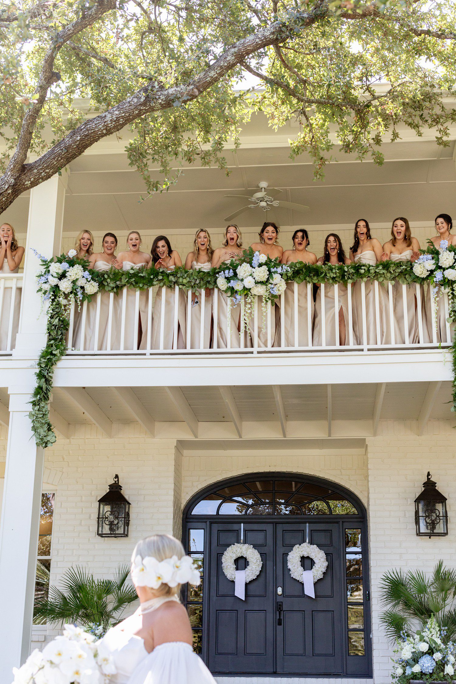Bridesmaid reveal on porch of house.