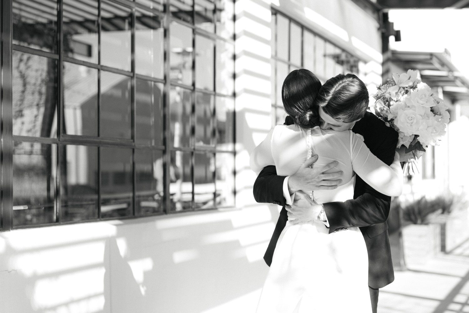Couple hugging after wedding first look at The Astorian in Houston. 