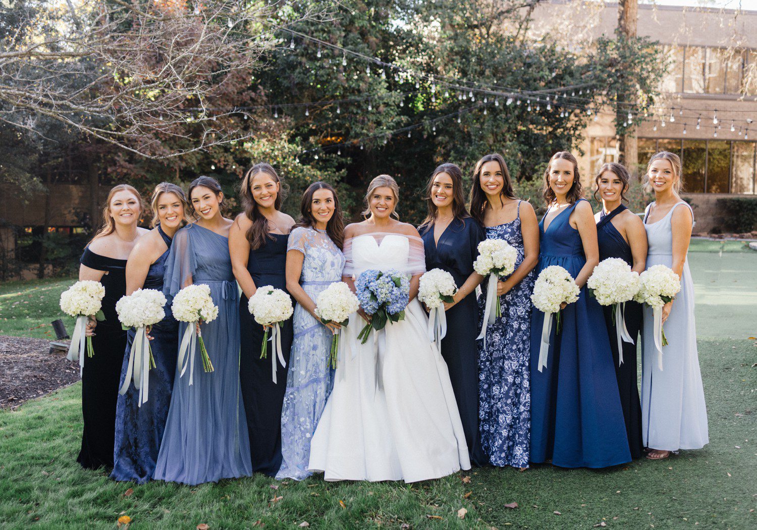 Bridesmaids photos at The Houstonian Hotel with bridesmaids in blue bridesmaid dresses with hydragea bouquets. 