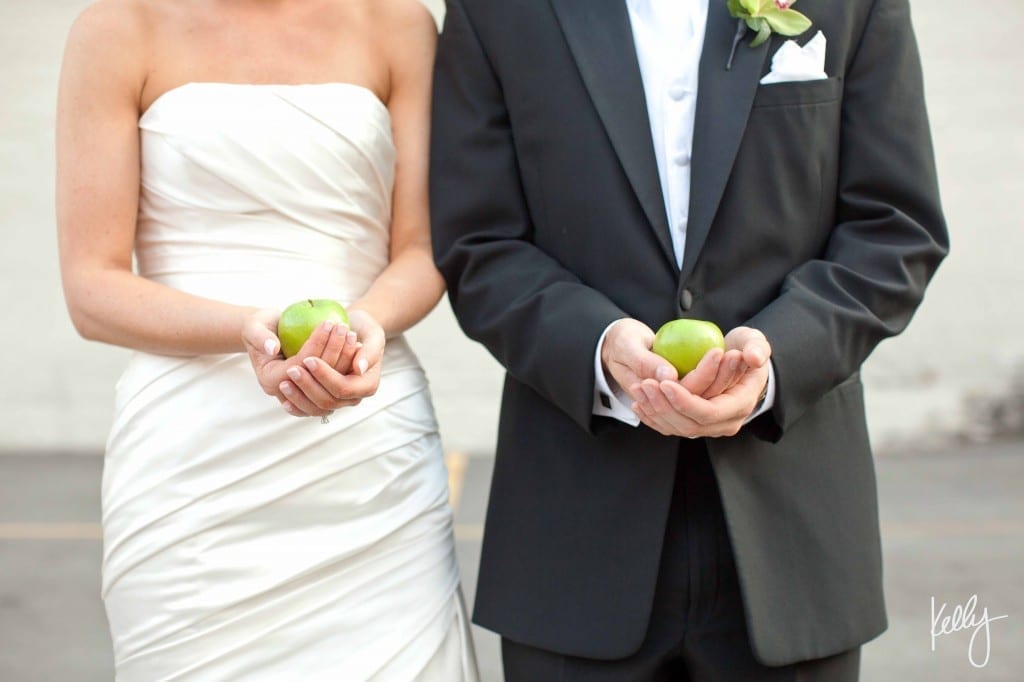 bride and groom with apples