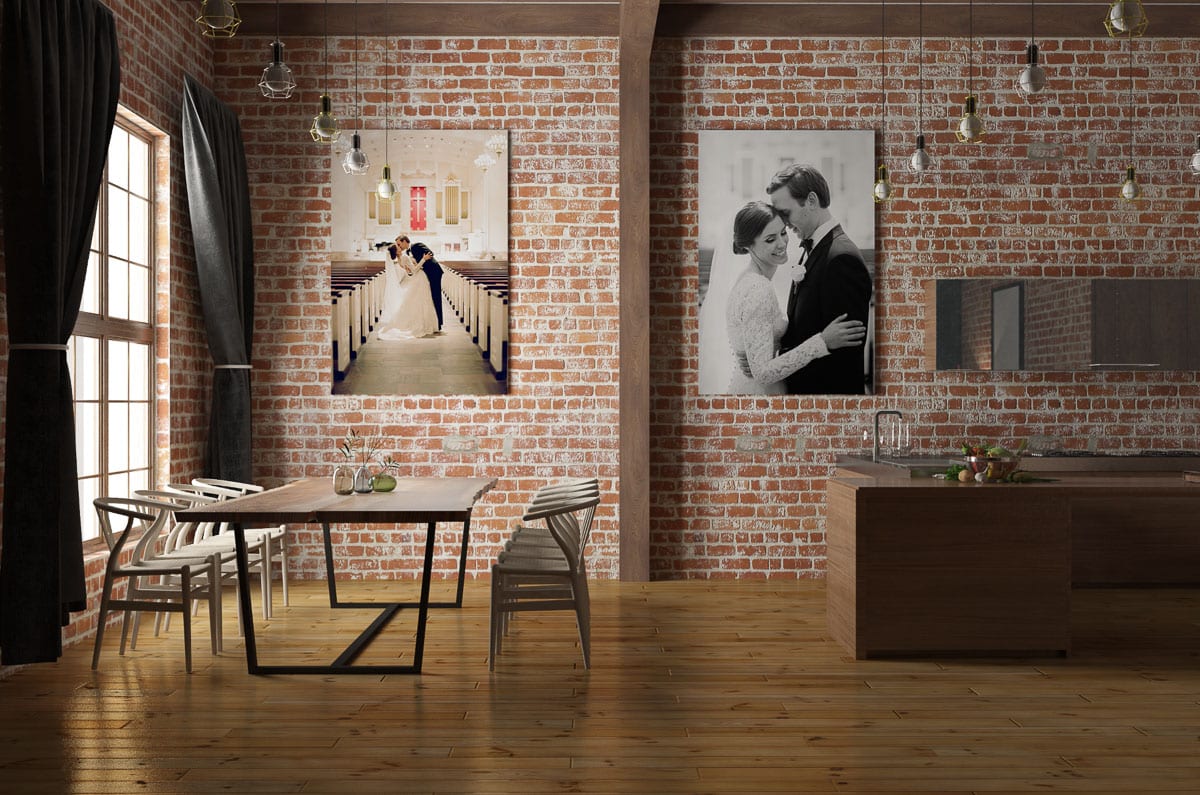 Large, professional quality canvas wedding prints are displayed against a brick kitchen wall showing ways to display your photos