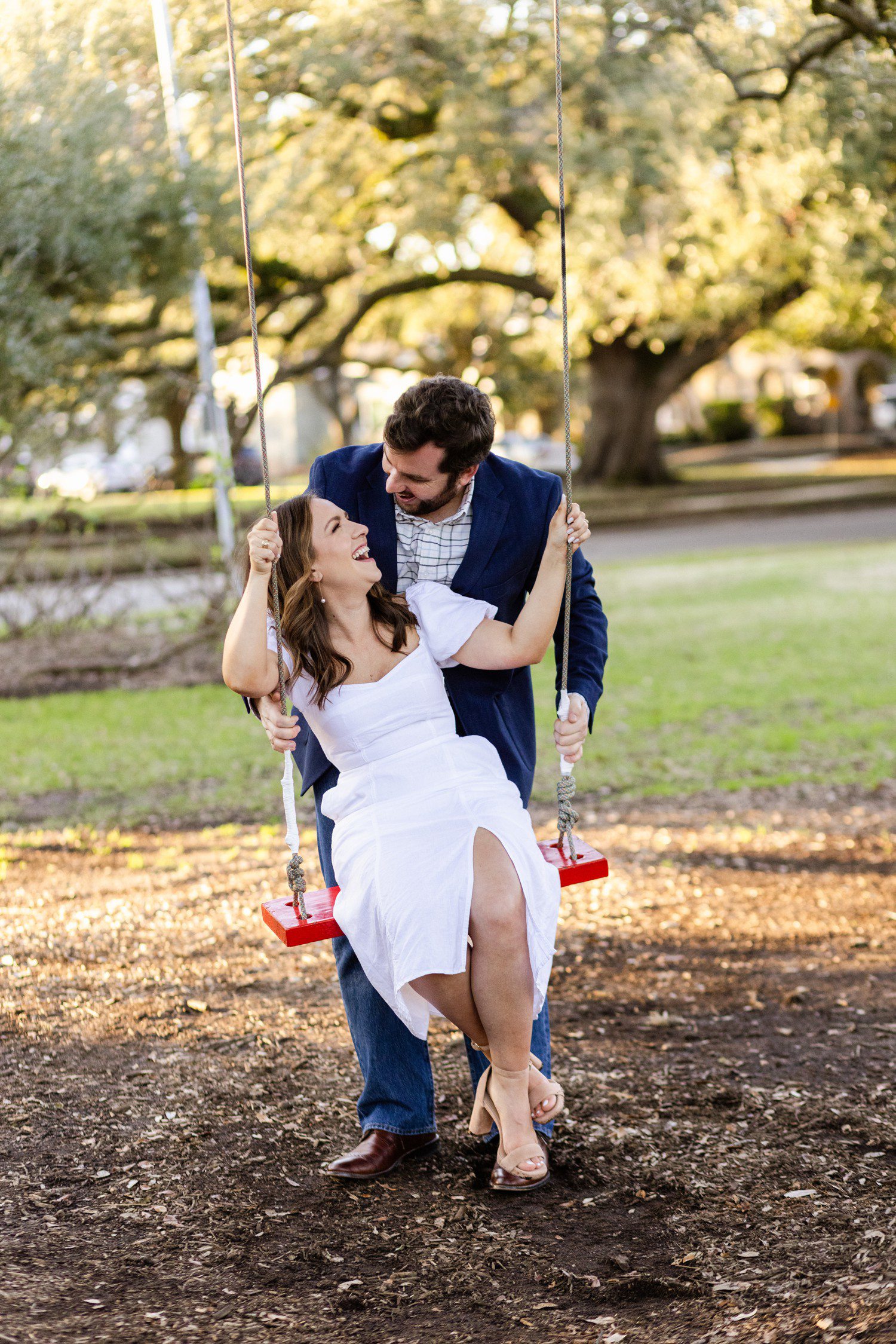 Menil Collection engagement photos outside with swing