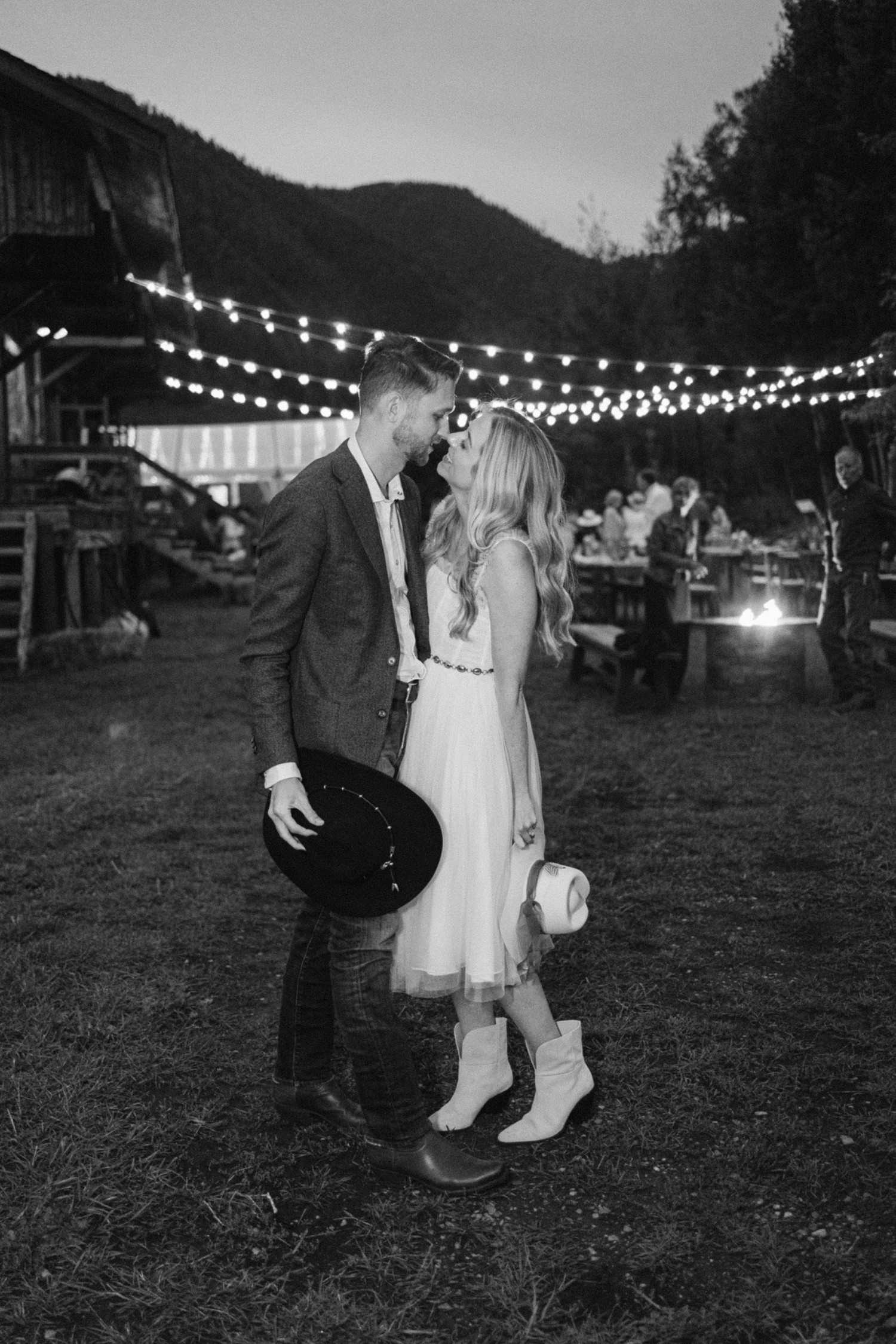 Bride and groom kissing at wedding rehearsal dinner in Aspen.