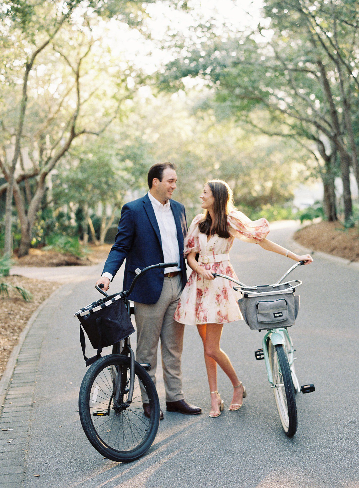 Couple with beach bikes for engagement photos in Florida.