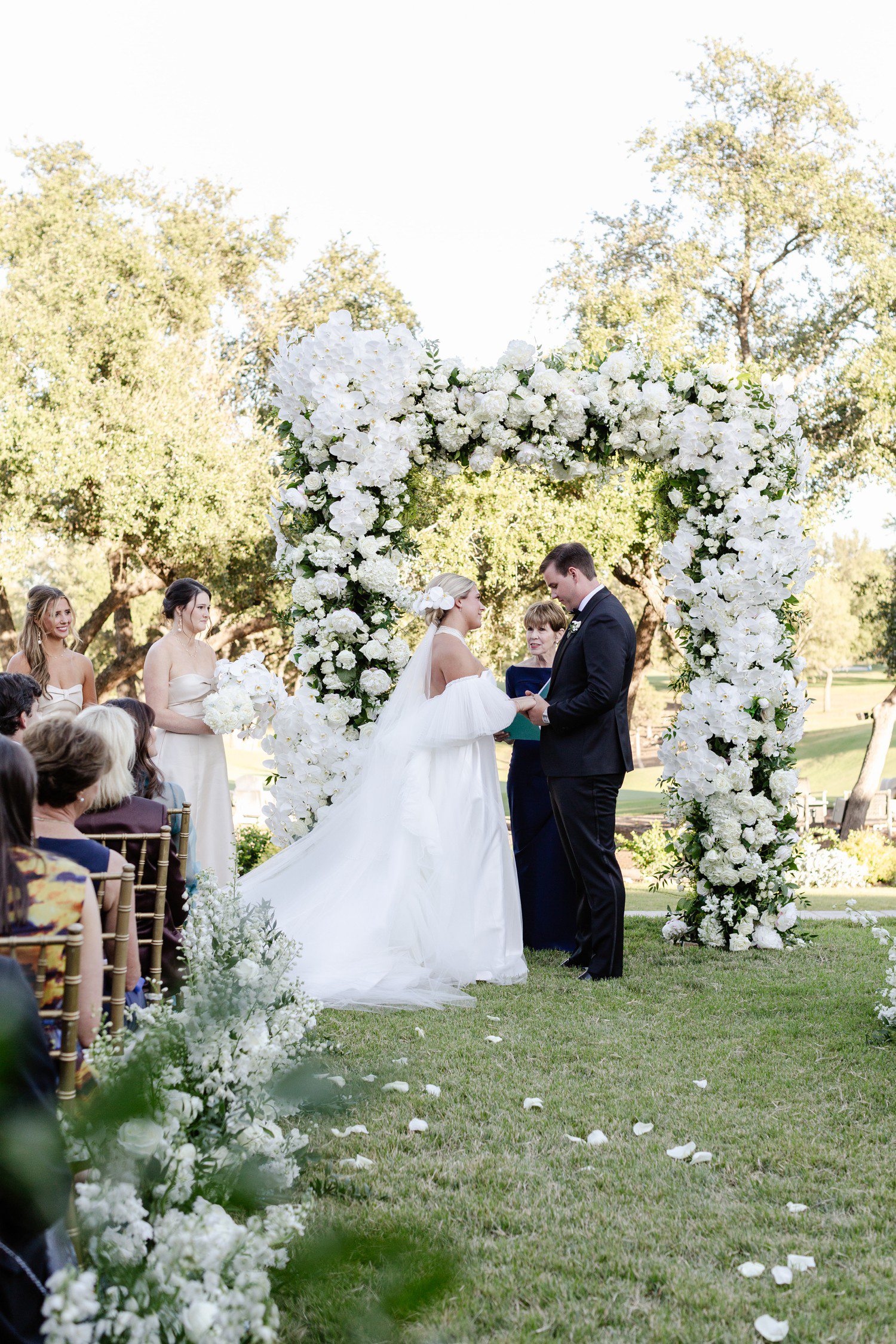 Bride and groom reading vows during wedding at Austin Country Club.