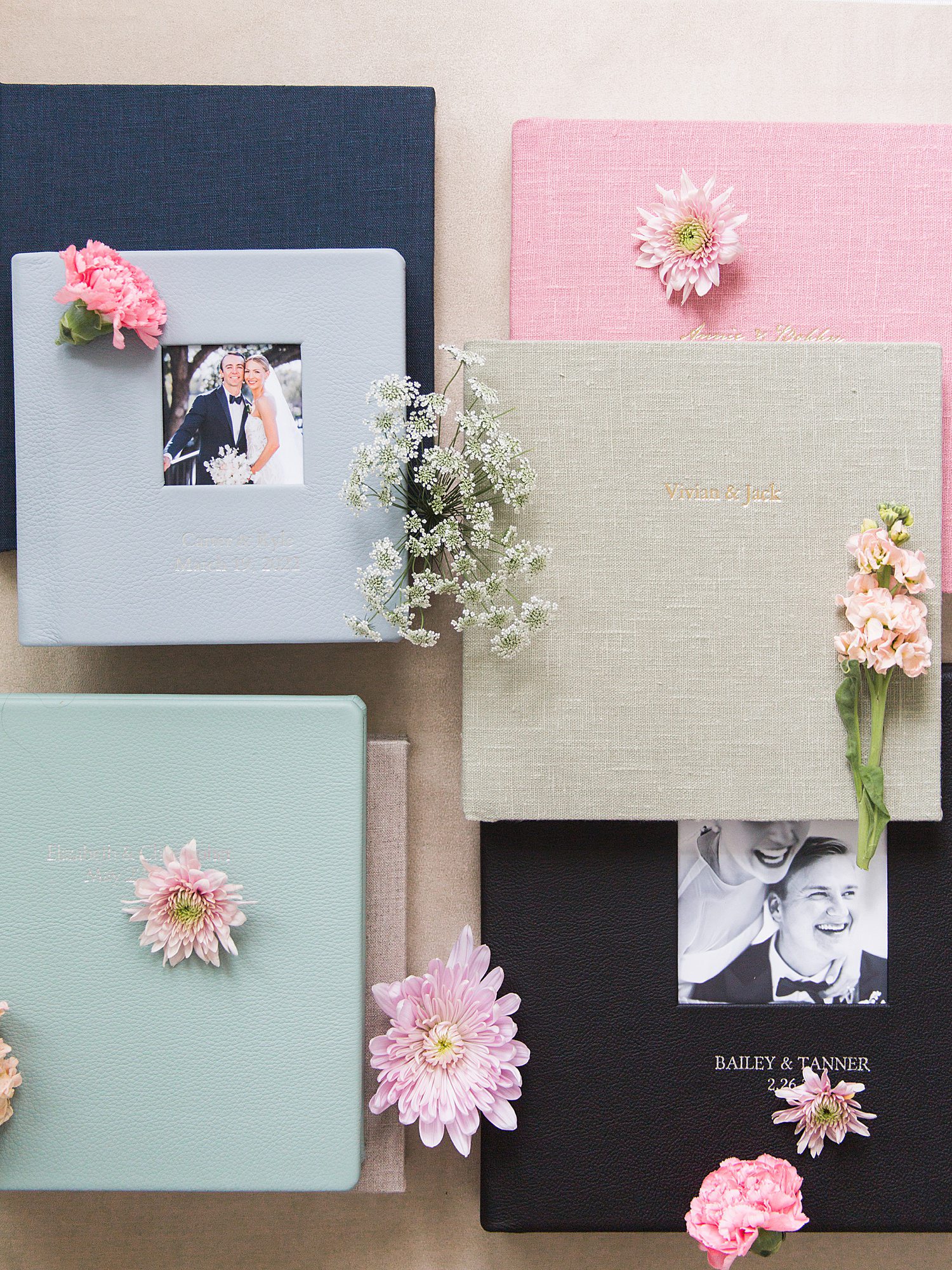 Variety of wedding albums with different colored covers