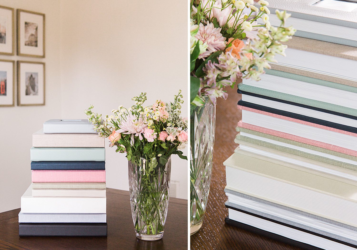 Multiple wedding photo albums stacked next to flowers